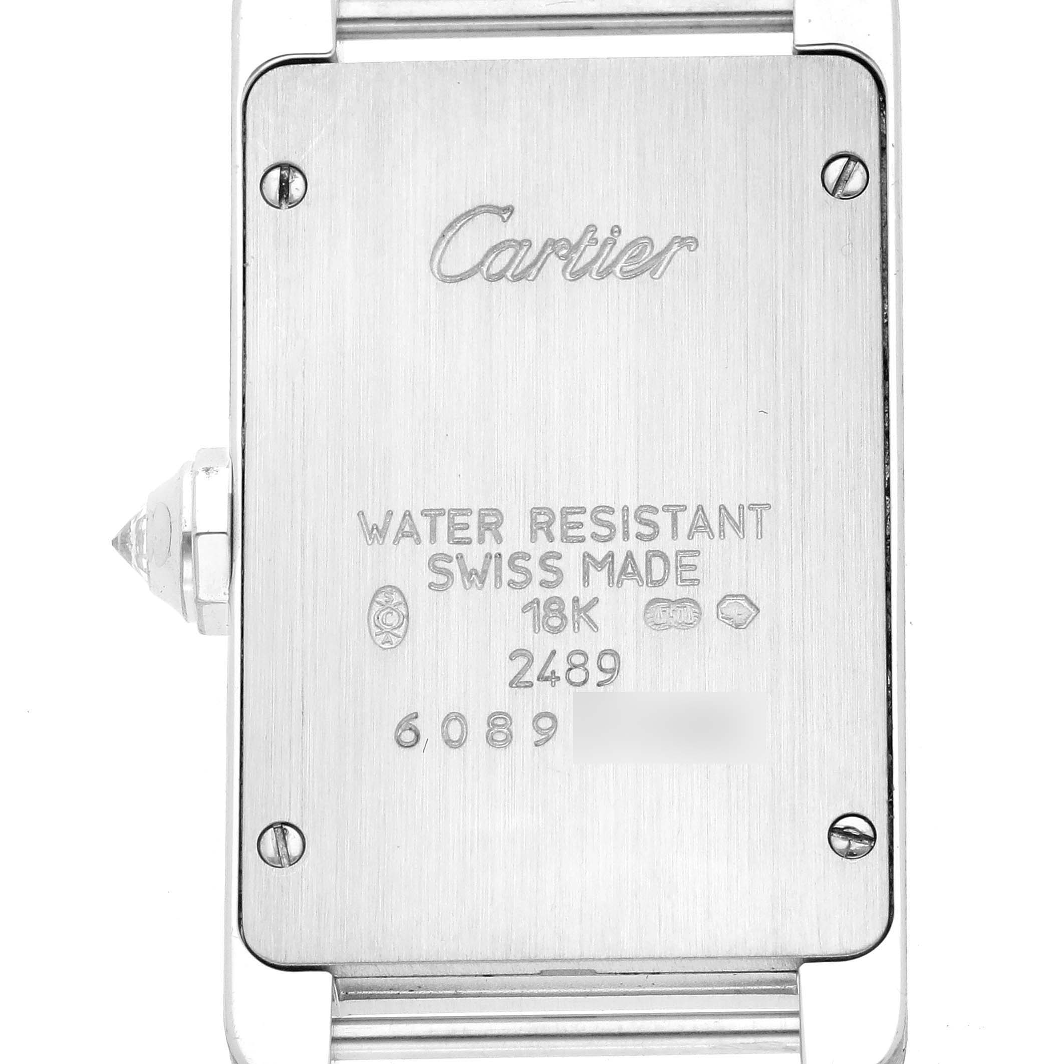 This image shows the back case of a Cartier Tank Americaine WB705131 Women's White Gold Grey Dial WB705131 Women's White Gold Grey Dial watch at a straight-on angle, highlighting the engravings and screws.