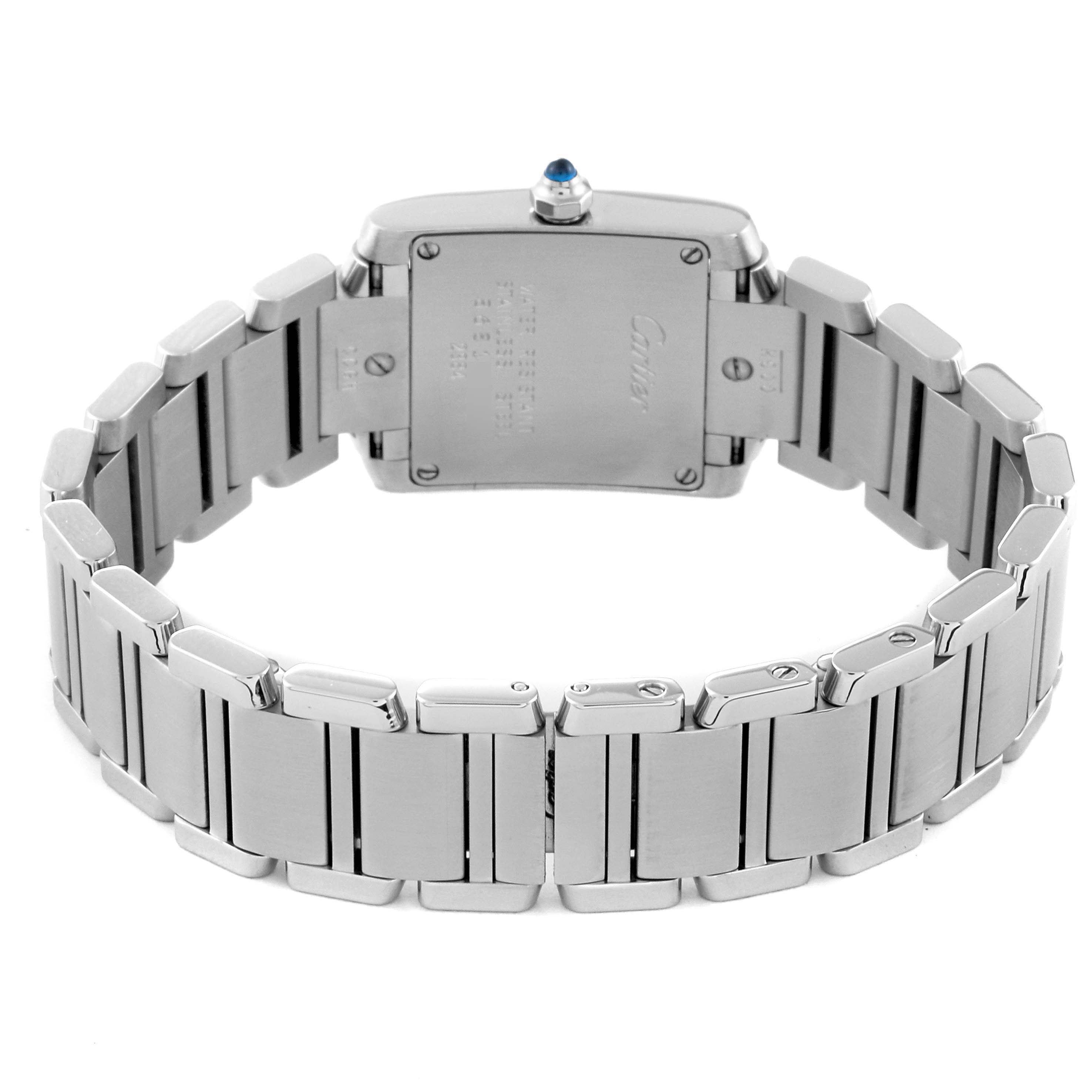 This image shows the back and bracelet of the Cartier Tank Française watch, focusing on the case back and metal links.