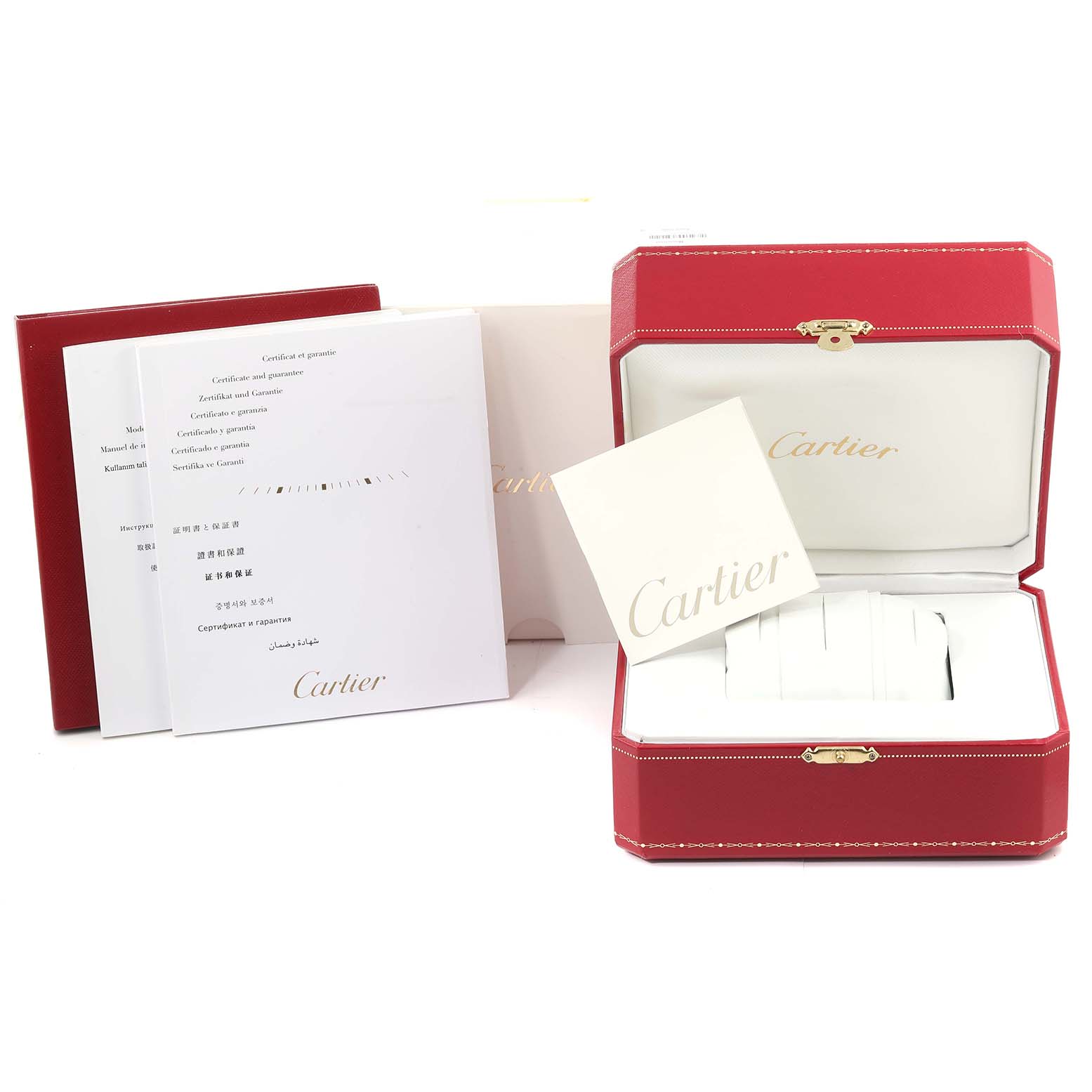 The image shows the box and documentation for a Cartier Tank MC WSTA0010 Men's Stainless Steel Blue Dial WSTA0010 Men's Stainless Steel Blue Dial model watch, including manuals and warranty cards.