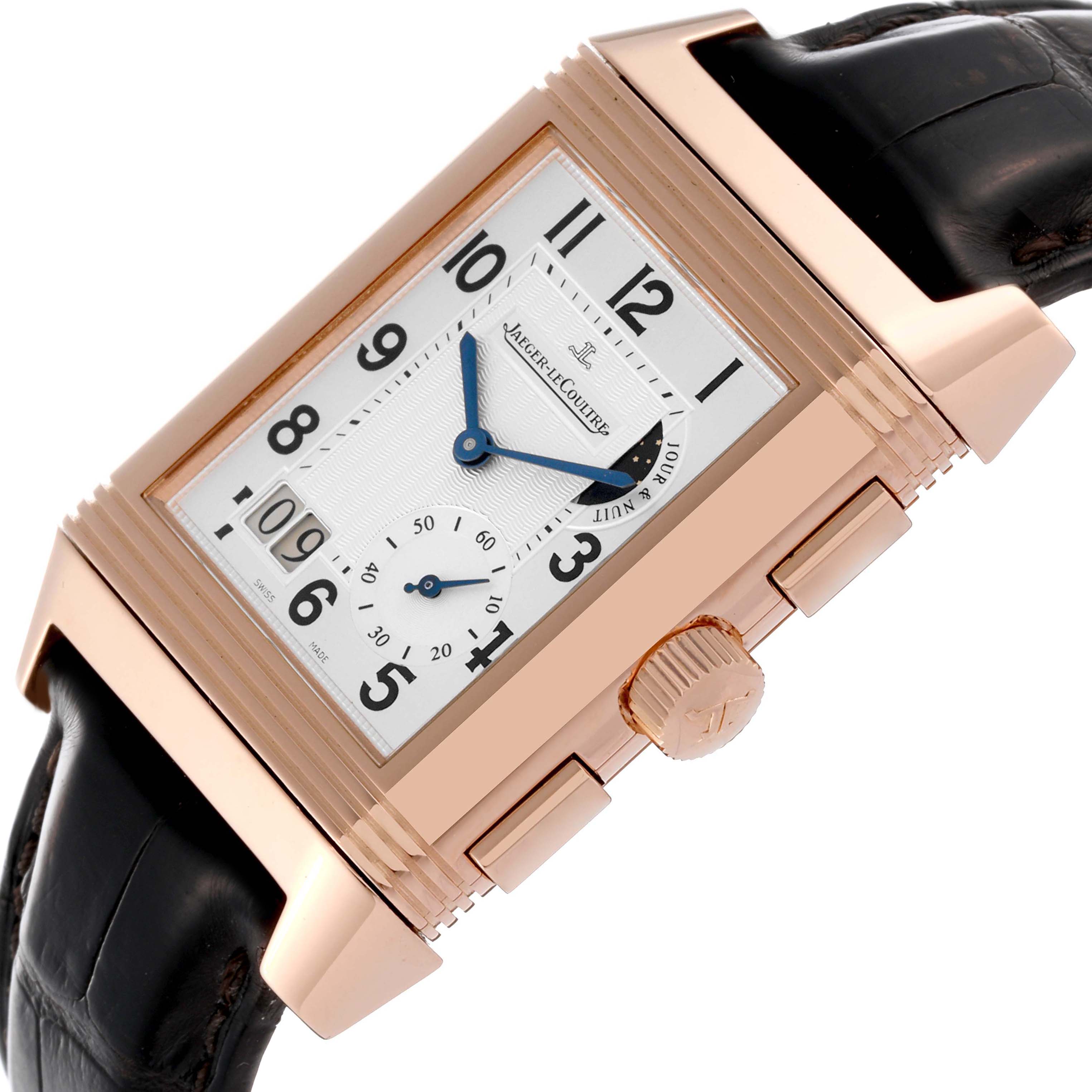 The image shows a Jaeger LeCoultre Reverso Q3022420 Men's Rose Gold Silver Dial Q3022420 Men's Rose Gold Silver Dial watch at an angled close-up, highlighting the dial, crown, and part of the strap.