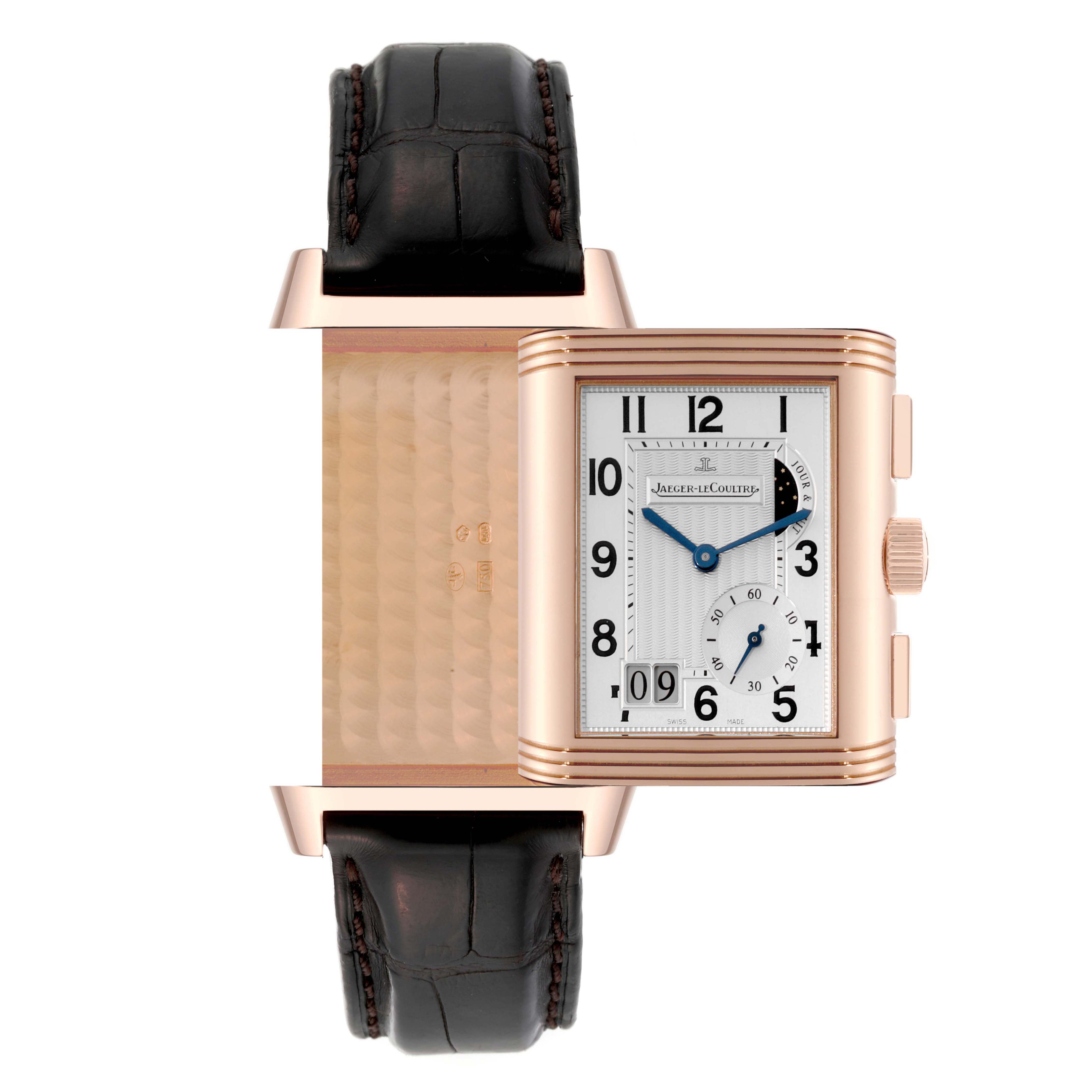 The Jaeger-LeCoultre Reverso watch is shown in an open position, displaying both the front dial and the case back.
