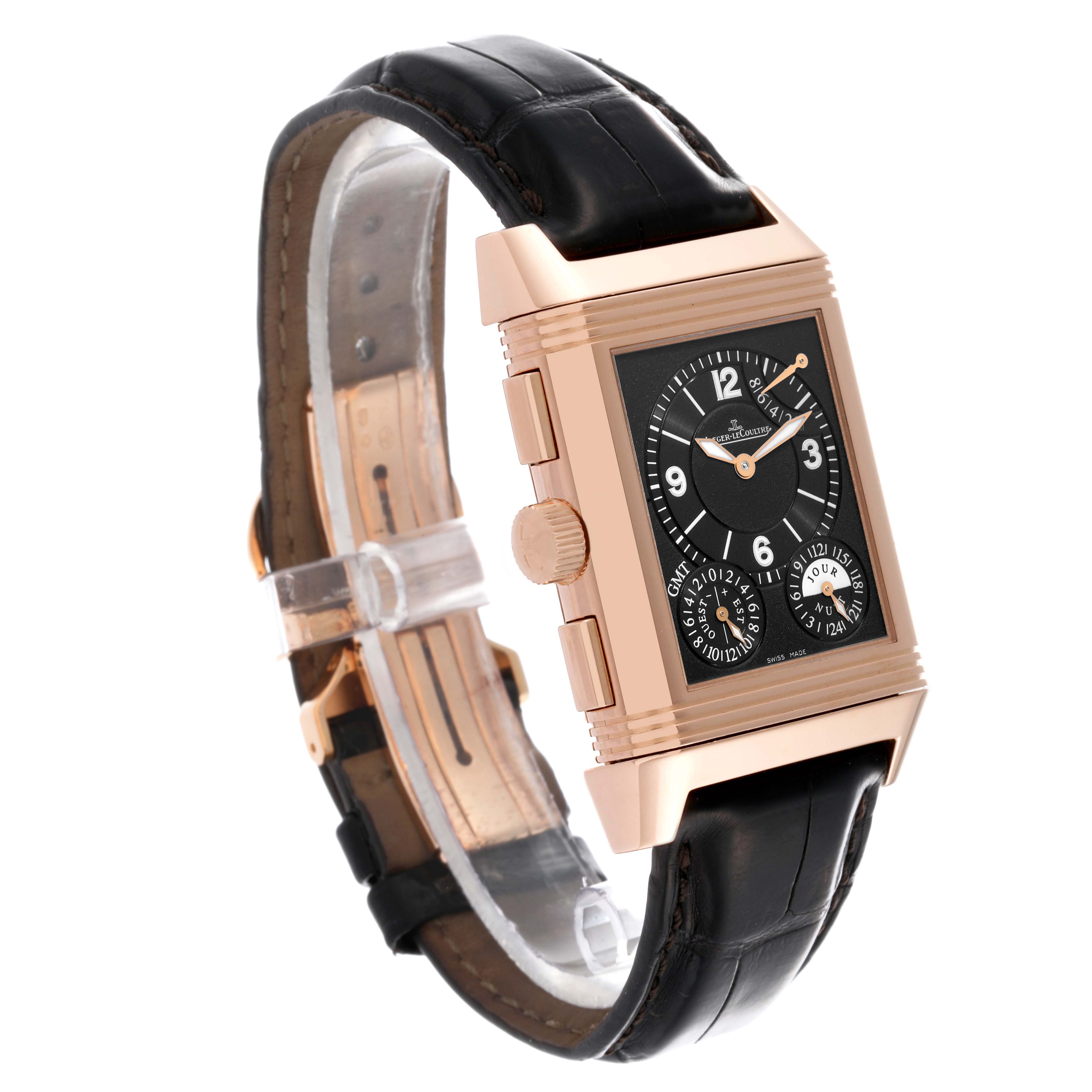 The Jaeger-LeCoultre Reverso watch is shown at a three-quarter angle, highlighting the face, case, crown, and strap.