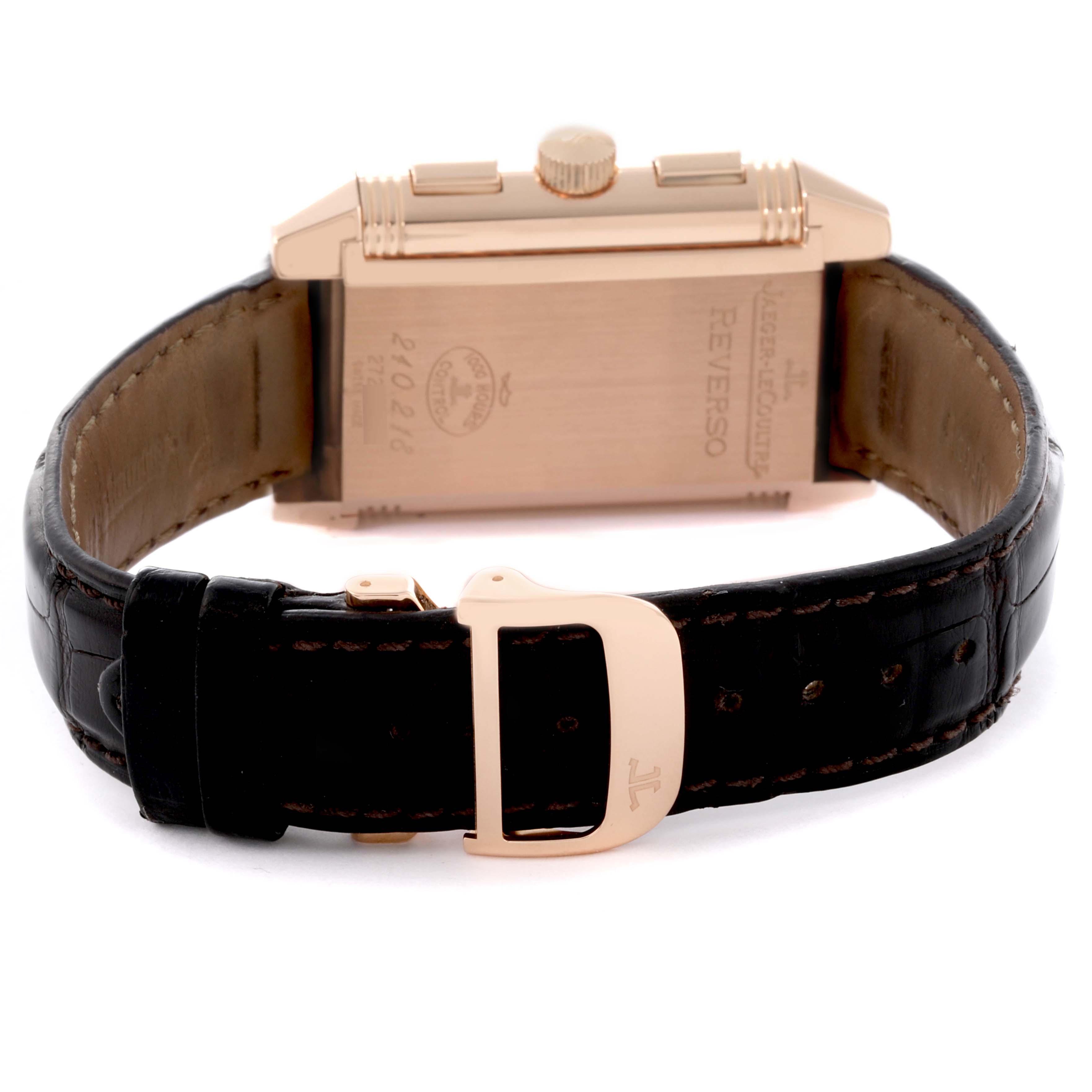 The Reverso by Jaeger-LeCoultre is shown from the back, displaying the case, crown, leather strap, and clasp.