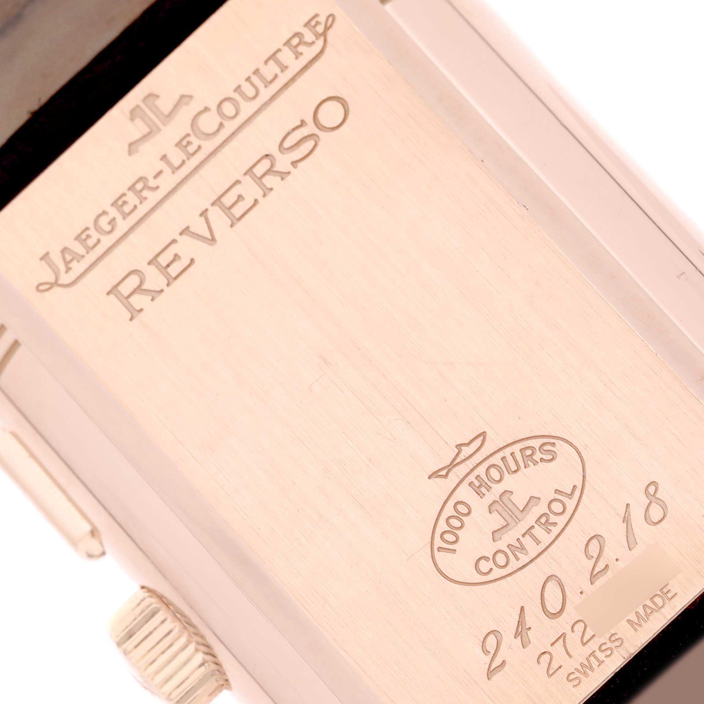The image shows the engraved case back of a Jaeger-LeCoultre Reverso watch from a close-up angle.