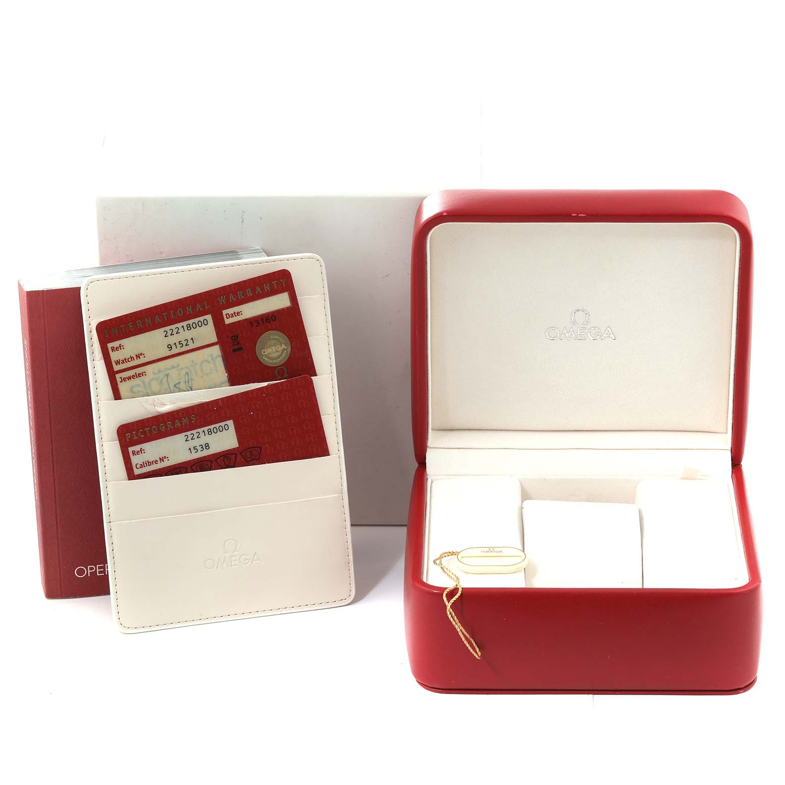 The image shows a red Omega Seamaster 2221.80.00 Men
s Stainless Steel Blue Dial 2221.80.00 Men
s Stainless Steel Blue Dial box, warranty cards in a white holder, and an empty interior watch display with a tag.