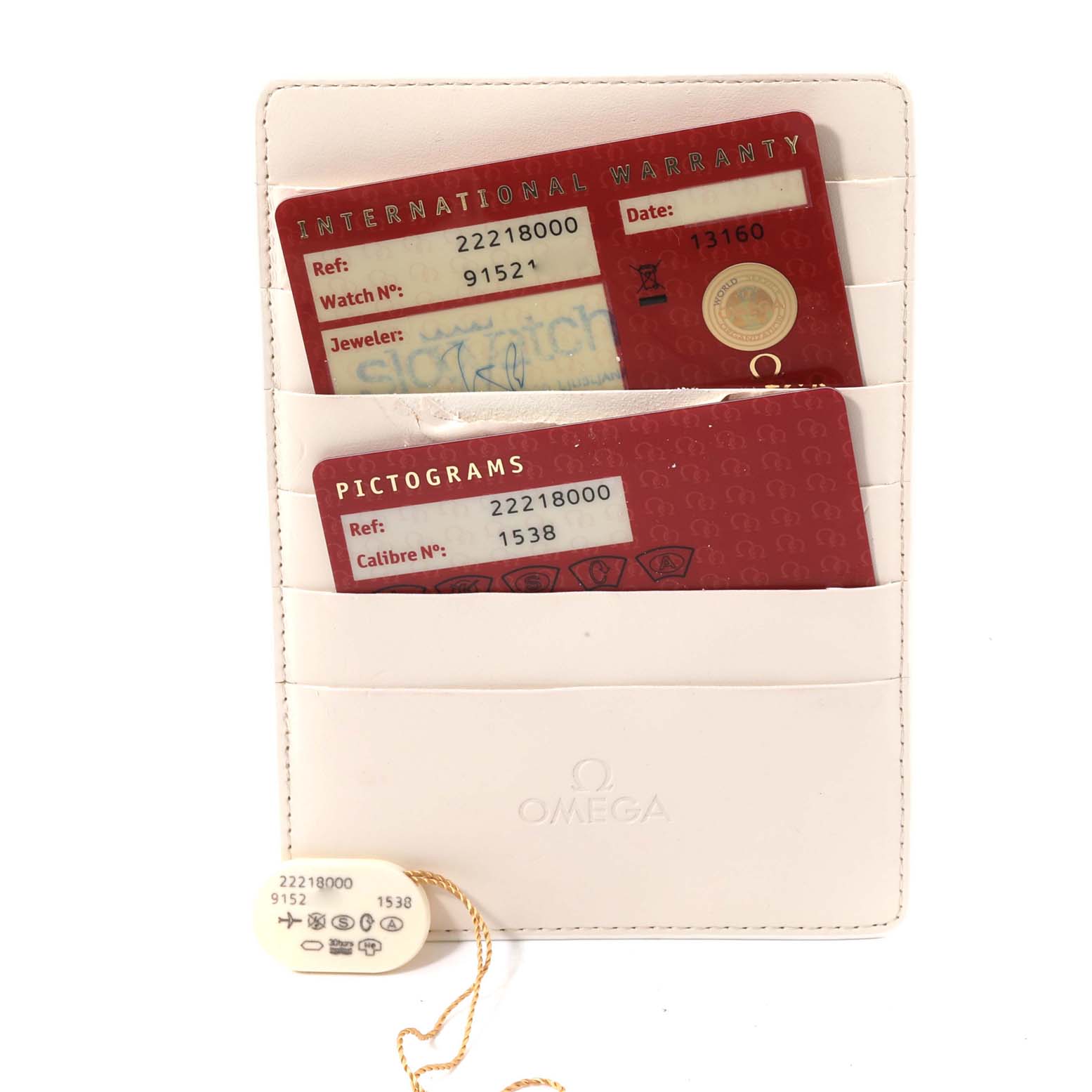 The image shows the warranty cards and tags for the Omega Seamaster 2221.80.00 Men
s Stainless Steel Blue Dial 2221.80.00 Men
s Stainless Steel Blue Dial model, displayed inside a white Omega holder.