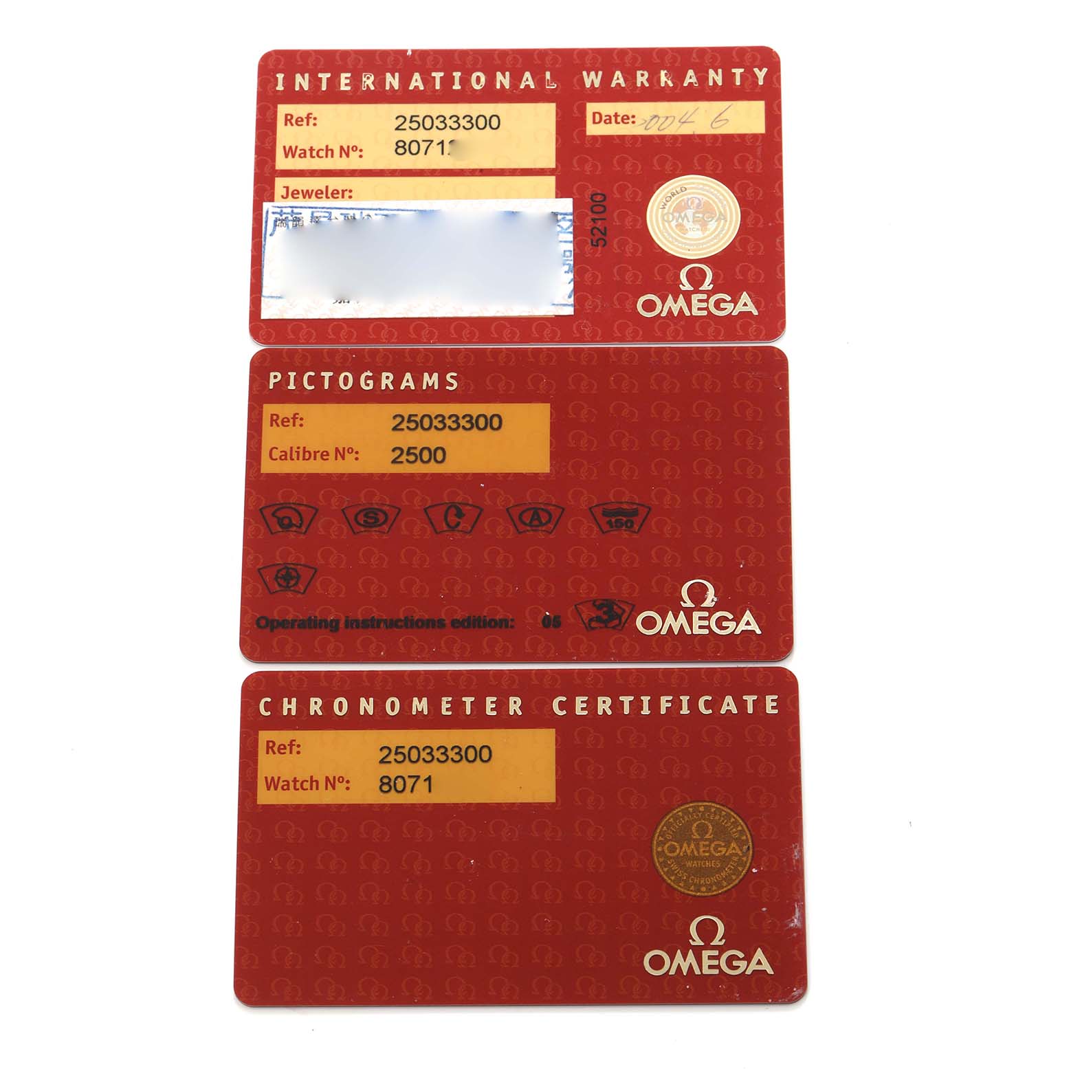 The image shows the Omega Aqua Terra model 2503.33.00's warranty, pictograms, and chronometer certificate cards, displayed flat from a top-down angle.