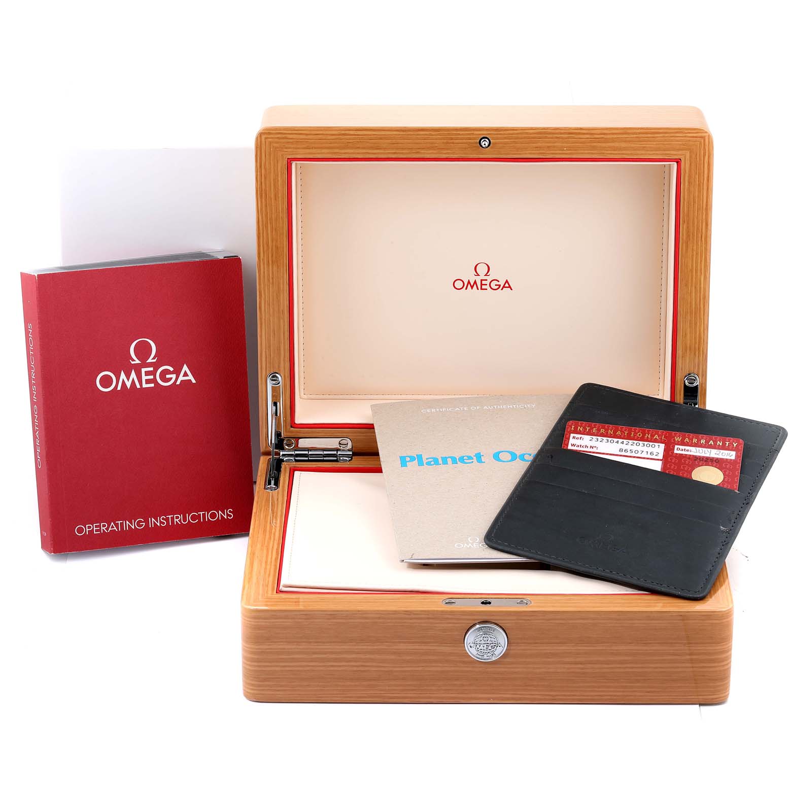The image shows the Planet Ocean model by Omega including its box, operating instructions, warranty card, and certificate of Best Quality
ity.