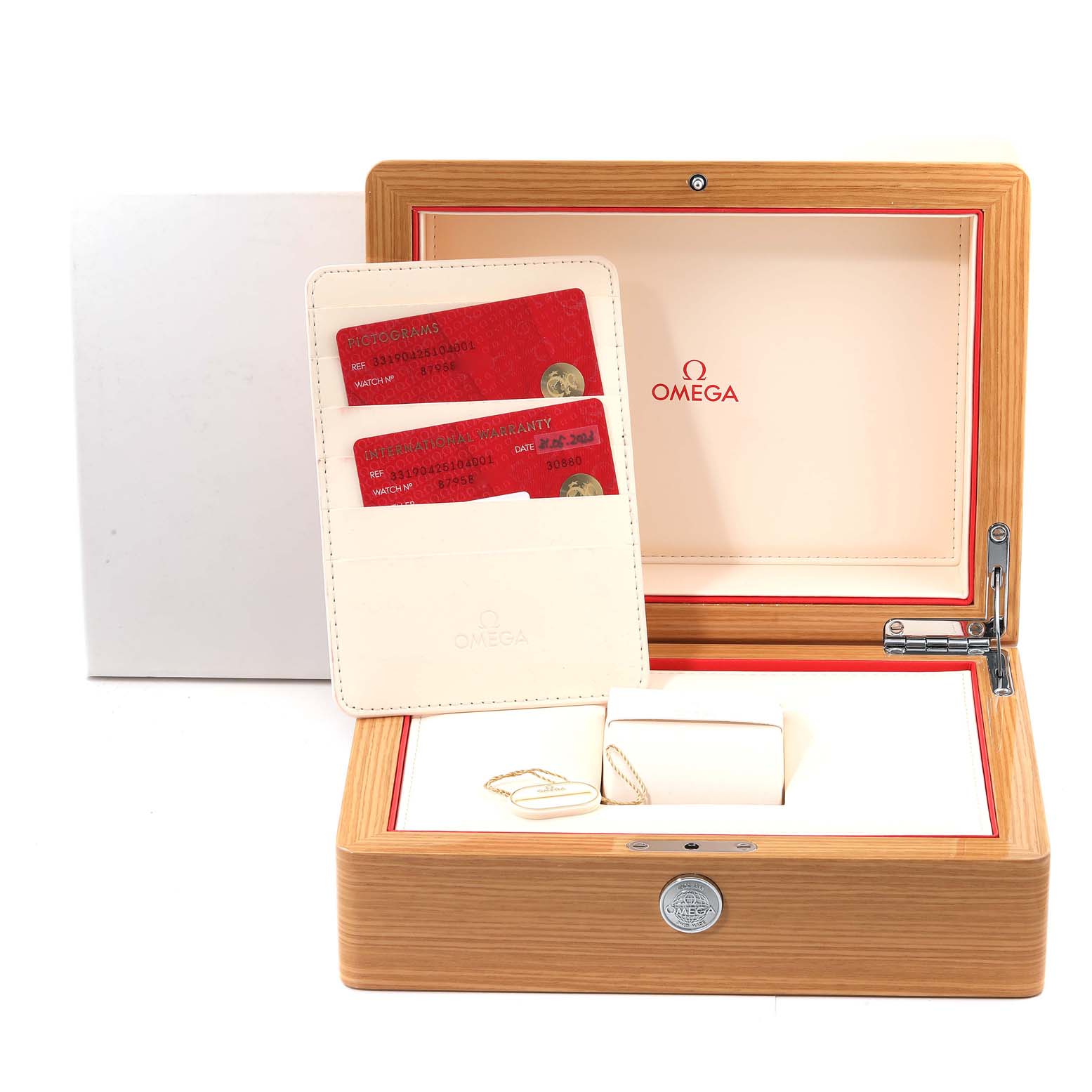 This image shows the wooden box, warranty cards, and accessories box for an Omega Speedmaster 331.90.42.51.04.001 Men's Titanium White Dial 331.90.42.51.04.001 Men's Titanium White Dial watch.