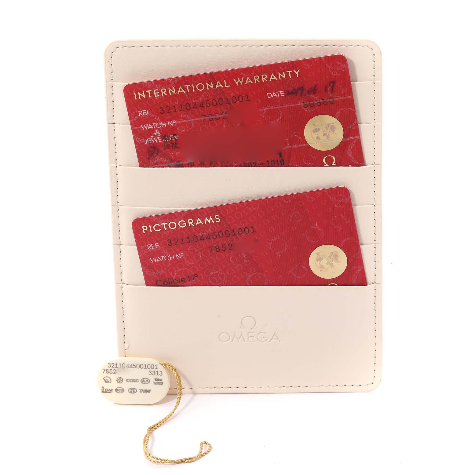 This image shows the warranty cards and a tag for the Omega Speedmaster 321.10.44.50.01.001 Men
s Stainless Steel Black Dial 321.10.44.50.01.001 Men
s Stainless Steel Black Dial watch, placed in a beige cardholder.