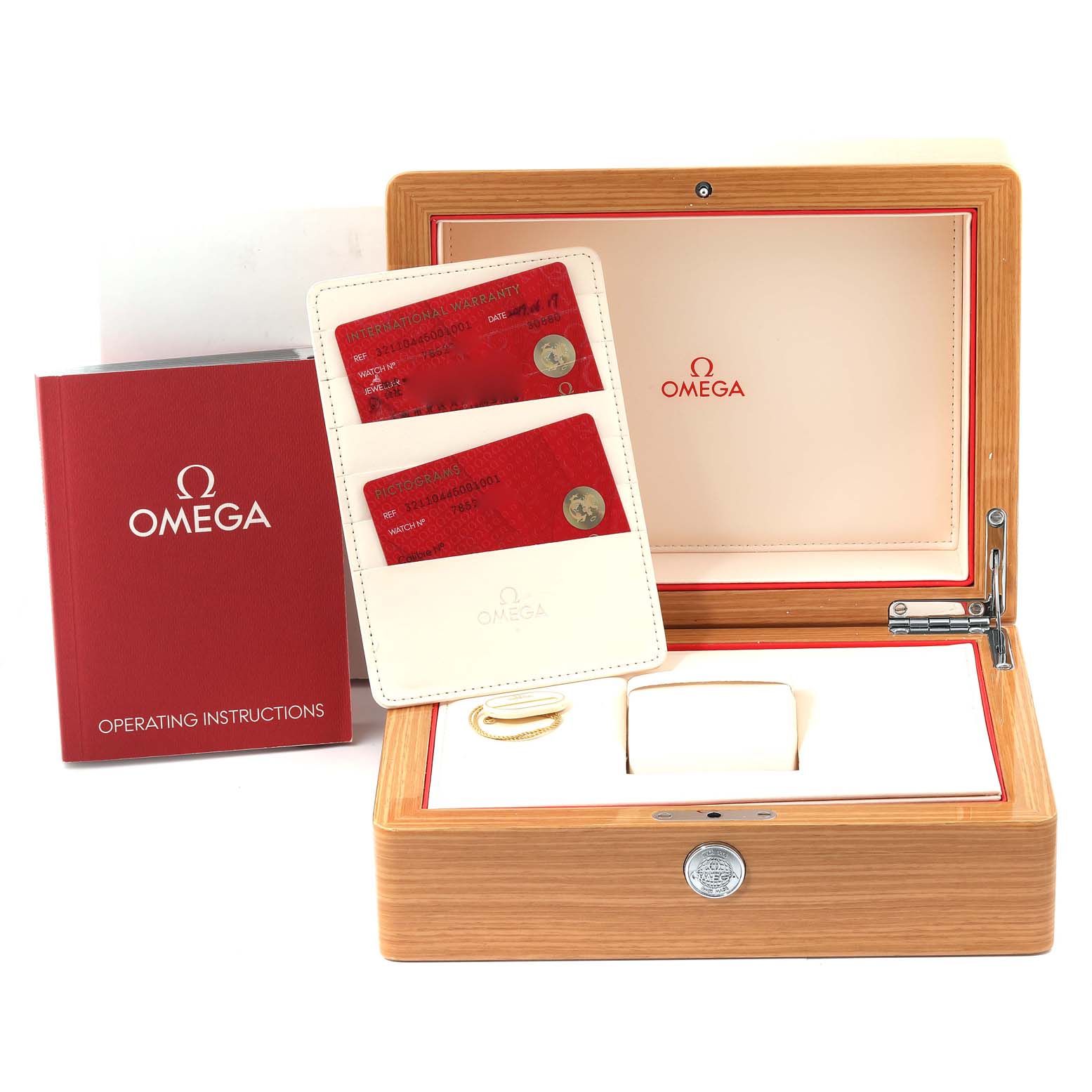 The image shows an open Omega Speedmaster 321.10.44.50.01.001 Men
s Stainless Steel Black Dial 321.10.44.50.01.001 Men
s Stainless Steel Black Dial watch box with operating instructions book, warranty cards, and accessories.