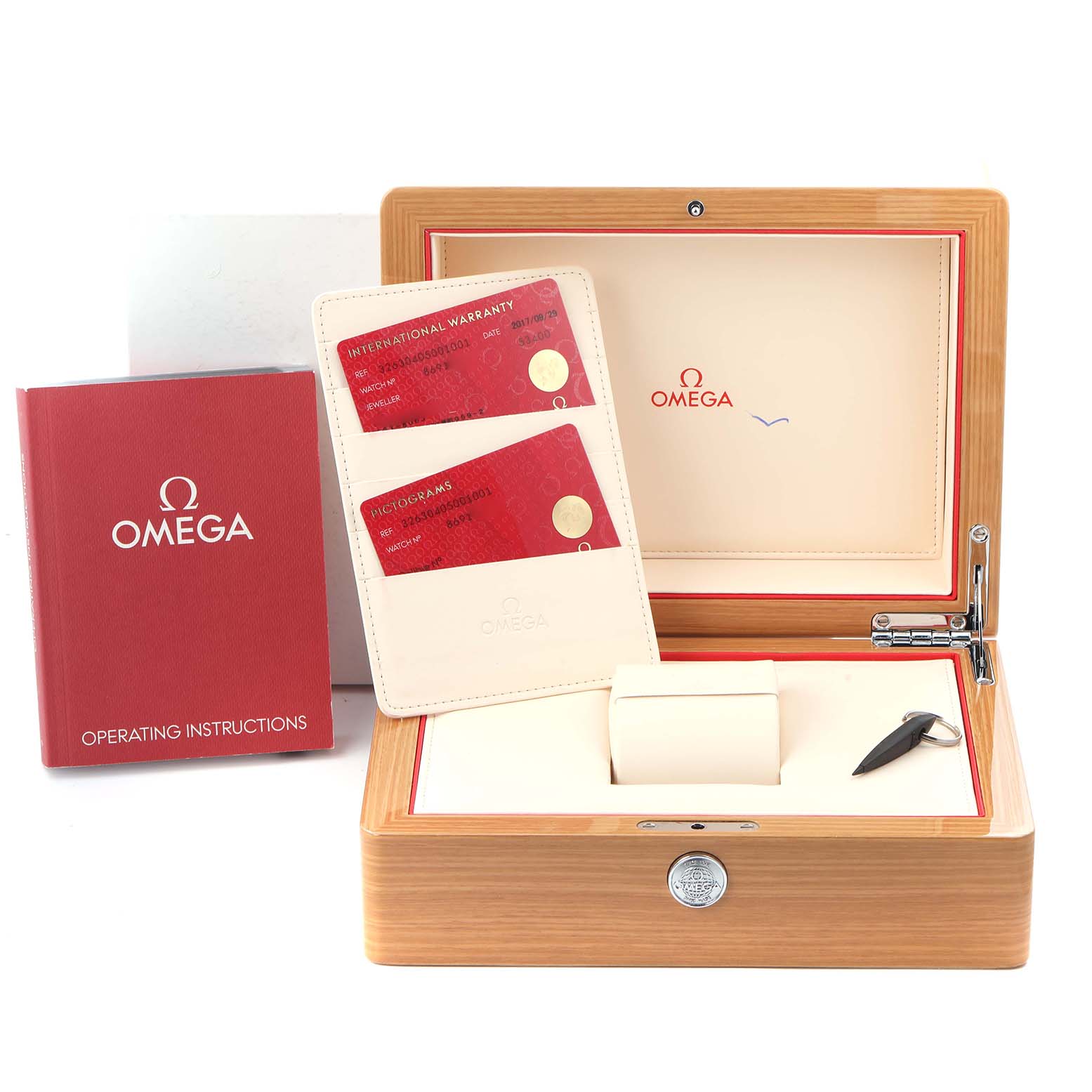 The image shows the Omega Speedmaster model 326.30.40.50.01.001 packaging, with an open box, warranty cards, and instruction manual.