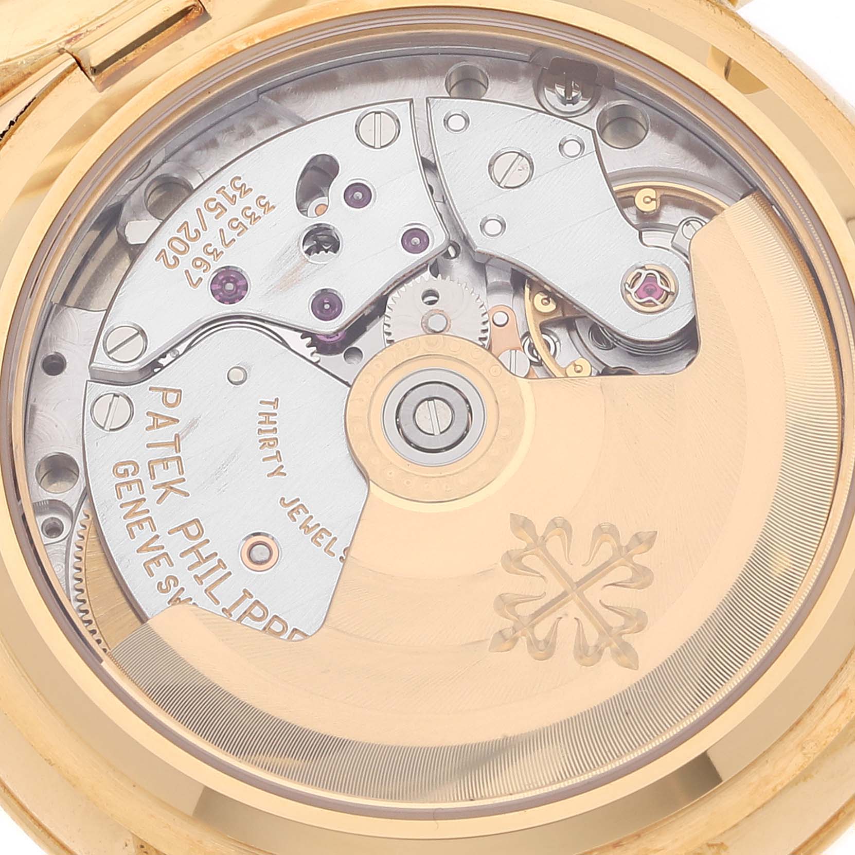 The image shows the intricate inner mechanism and rotor of a Patek Philippe Calatrava 5053 Men's Yellow Gold Beige Dial 5053 Men's Yellow Gold Beige Dial watch, viewed from the back.