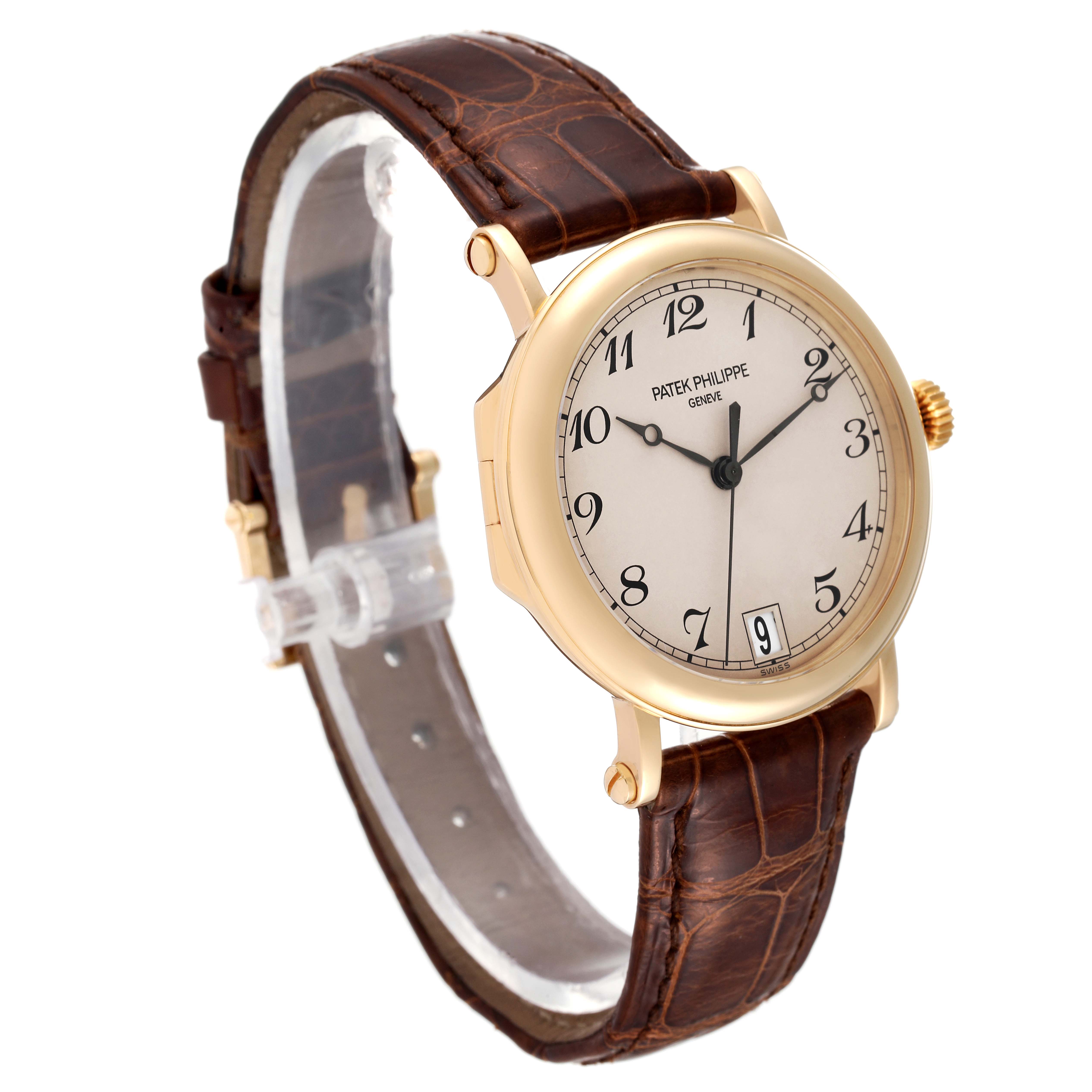 This image shows a Calatrava model by Patek Philippe at a three-quarter angle, highlighting the face, band, and case.