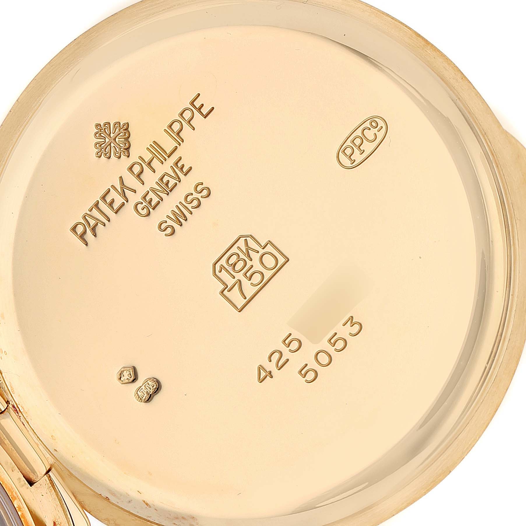 The image shows the inside case back of a Patek Philippe Calatrava 5053 Men's Yellow Gold Beige Dial 5053 Men's Yellow Gold Beige Dial watch, detailing engravings and hallmarks.