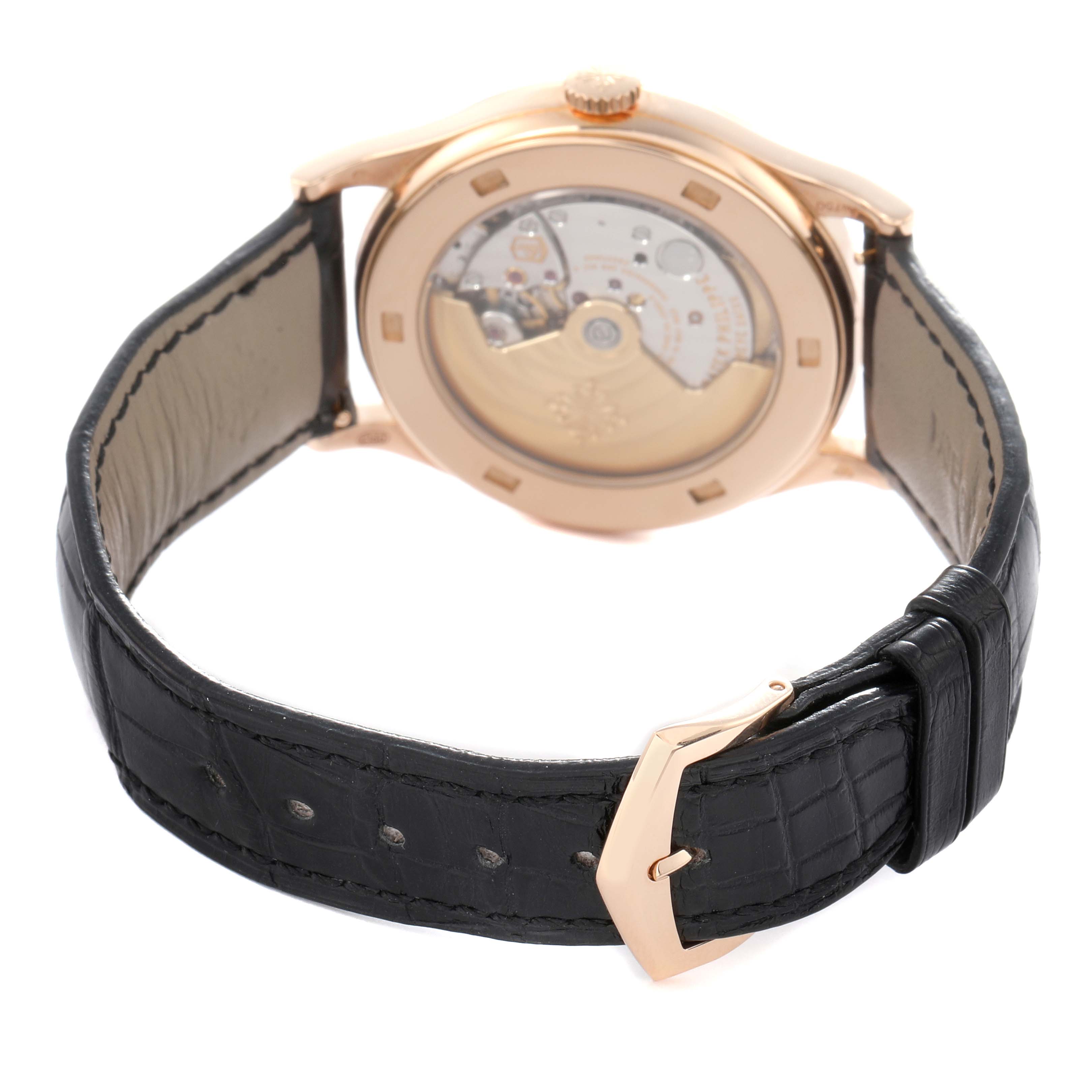 The image shows the back view of the Patek Philippe Calatrava model 5296R-001, highlighting the transparent case back and black leather strap with a buckle.