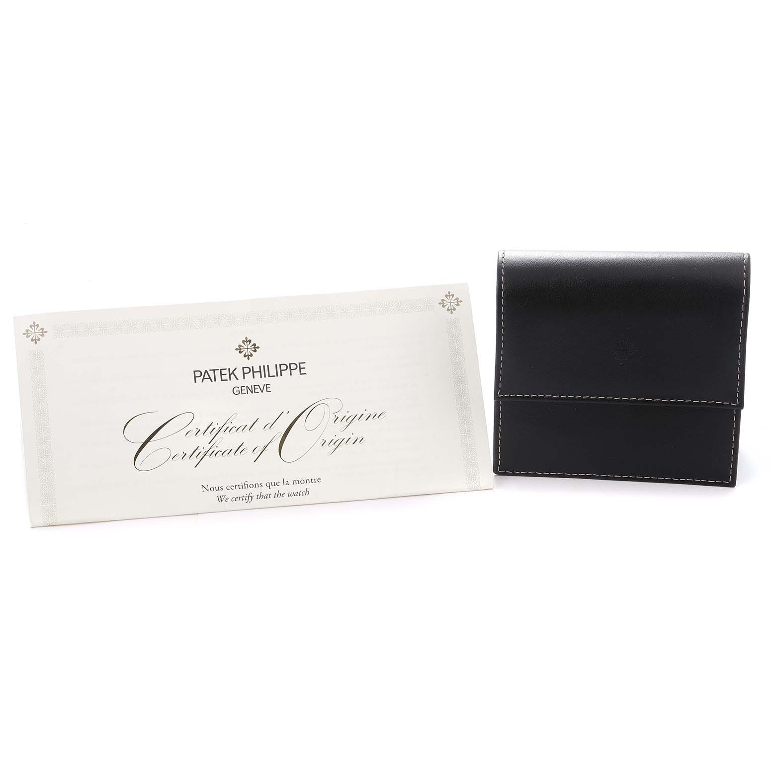 The image shows a Certificate of Origin and a black leather case for the Patek Philippe Calatrava model 5296R-001 men's watch.