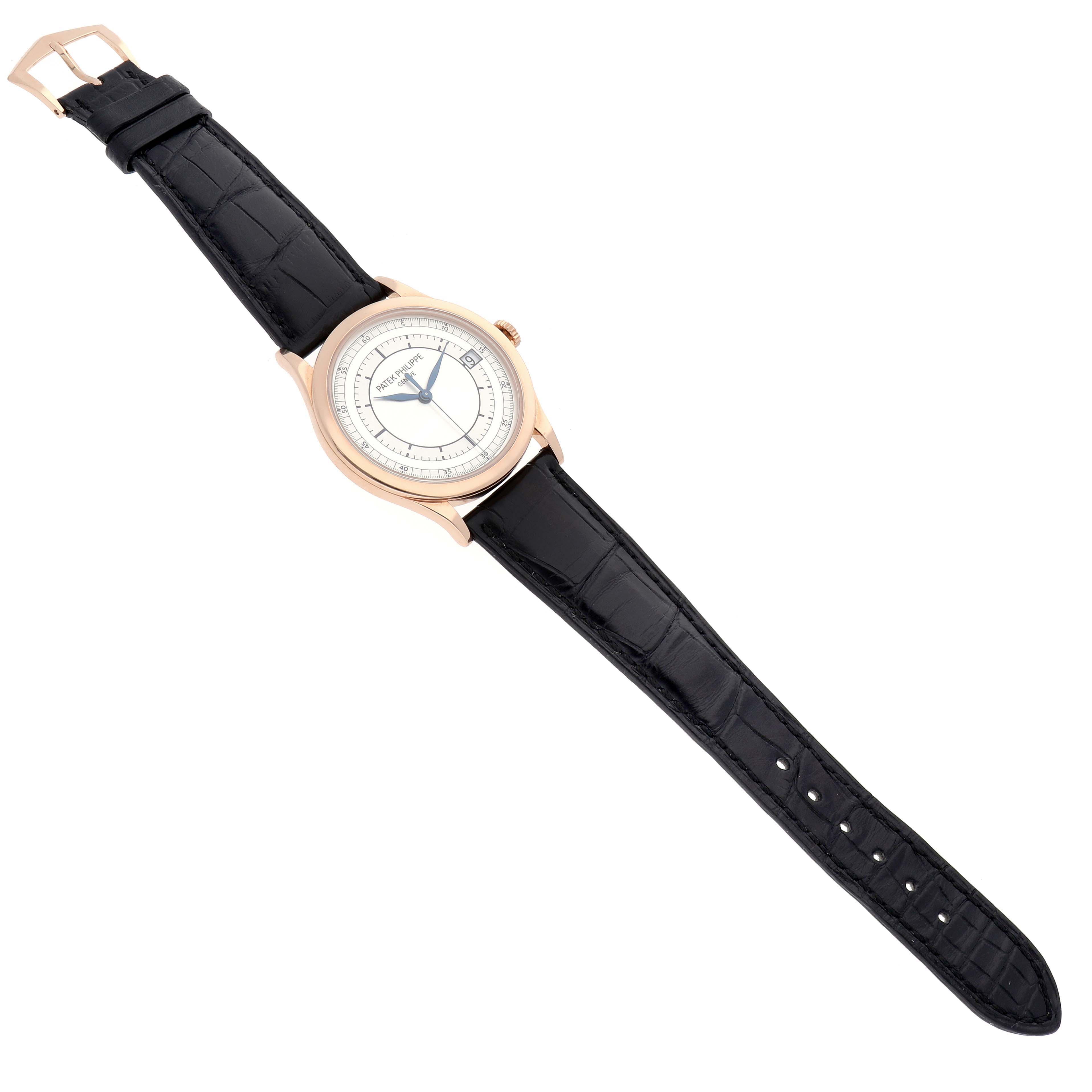 The Patek Philippe Calatrava model 5296R-001 men's watch is shown from a top-down angle, displaying the full face and black leather strap.