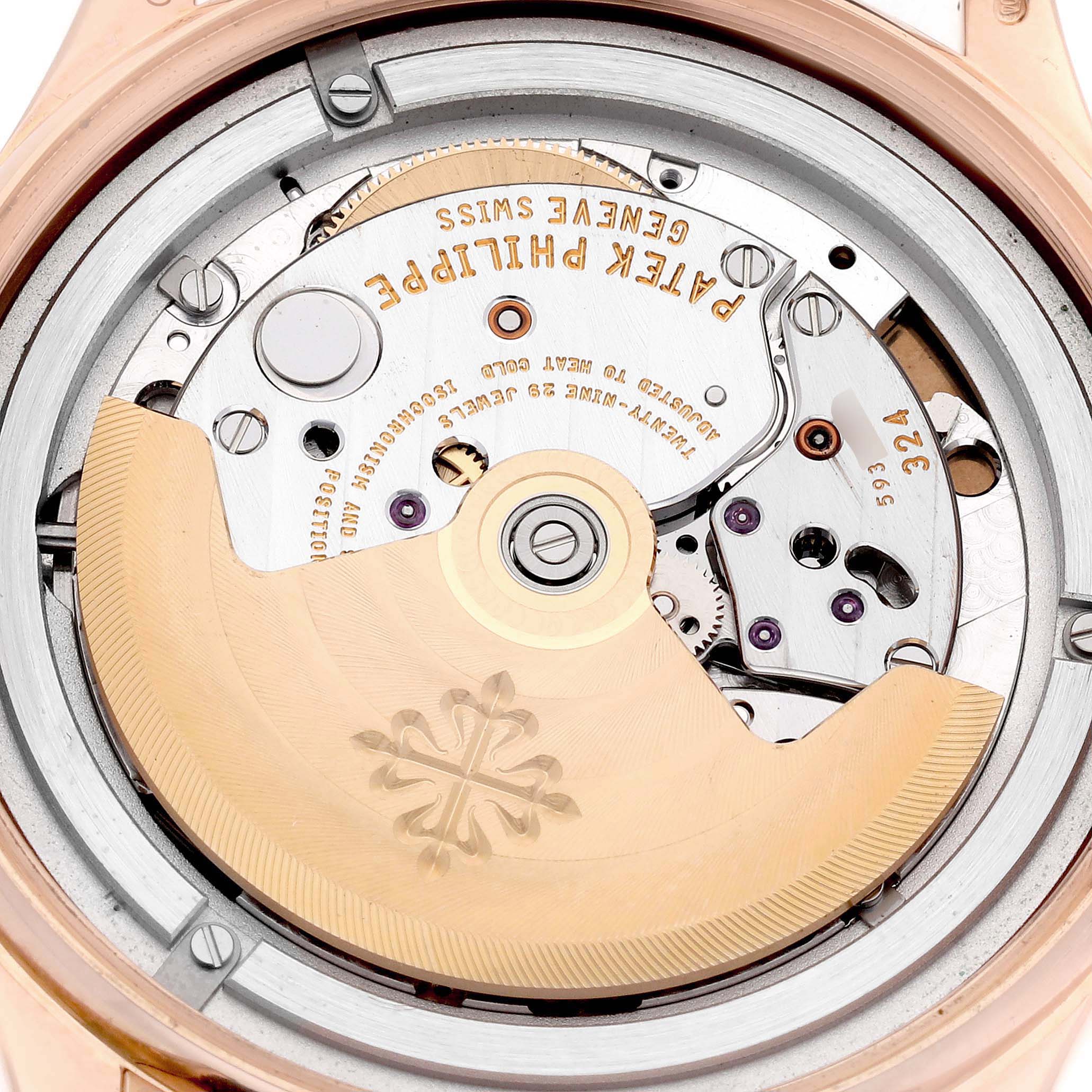 The image shows the movement of a Patek Philippe Calatrava model 5296R-001 from the back, highlighting its intricate mechanical components and rotor.