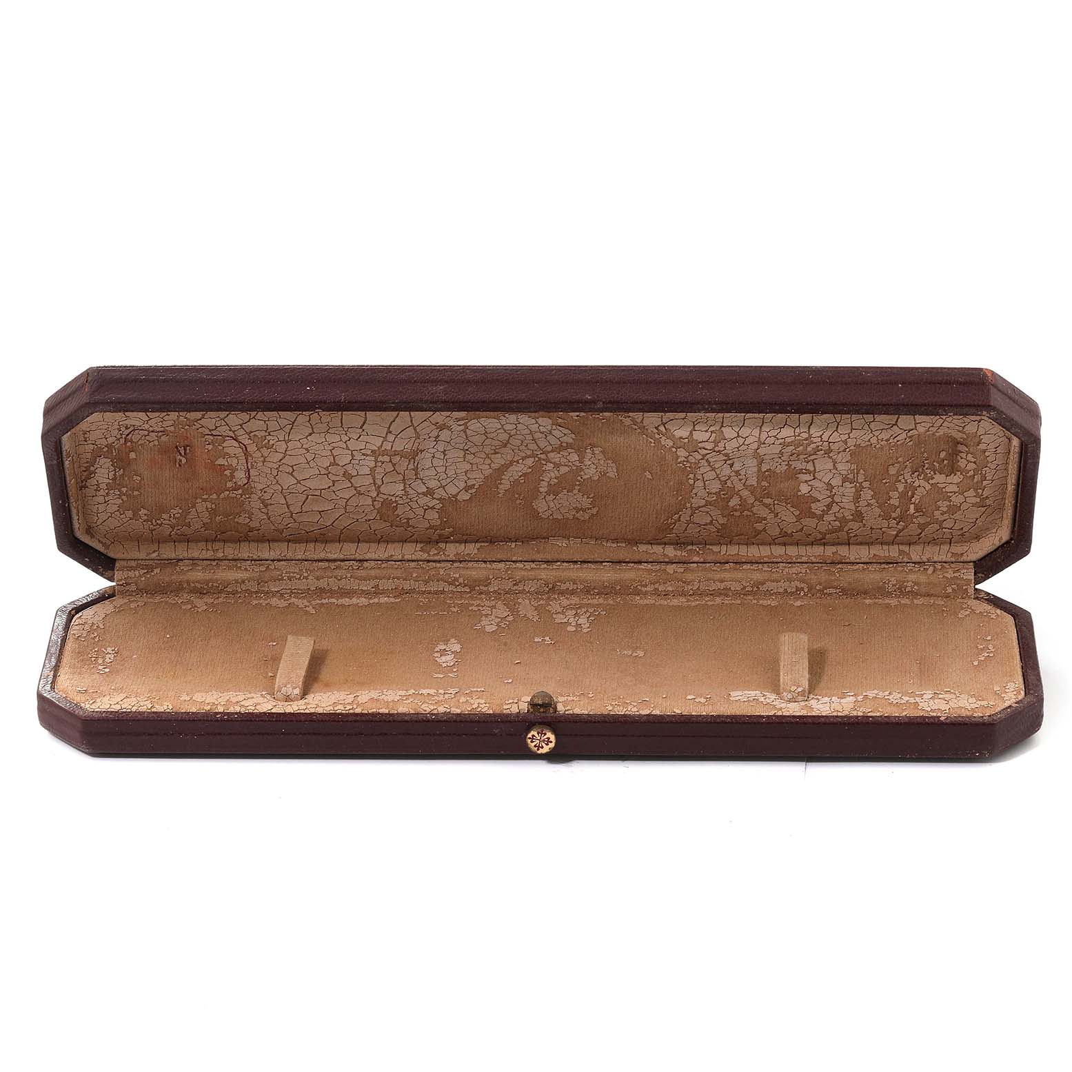 The image shows an open, empty watch case for a Calatrava model by Patek Philippe, viewed from the front.