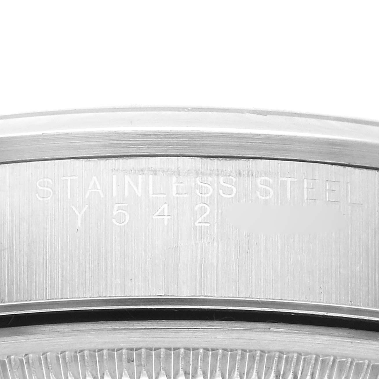 This image shows a close-up of the engraved caseback side of a Rolex Air-King 14000M Men's Stainless Steel Black Dial 14000M Men's Stainless Steel Black Dial watch, indicating it is made of stainless steel.