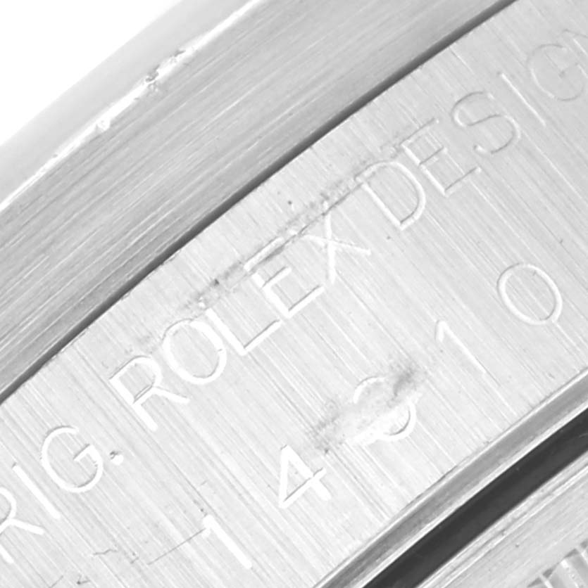 This close-up image shows the engraved bezel of a Rolex Air-King 14010 Men's Stainless Steel Black Dial 14010 Men's Stainless Steel Black Dial watch.