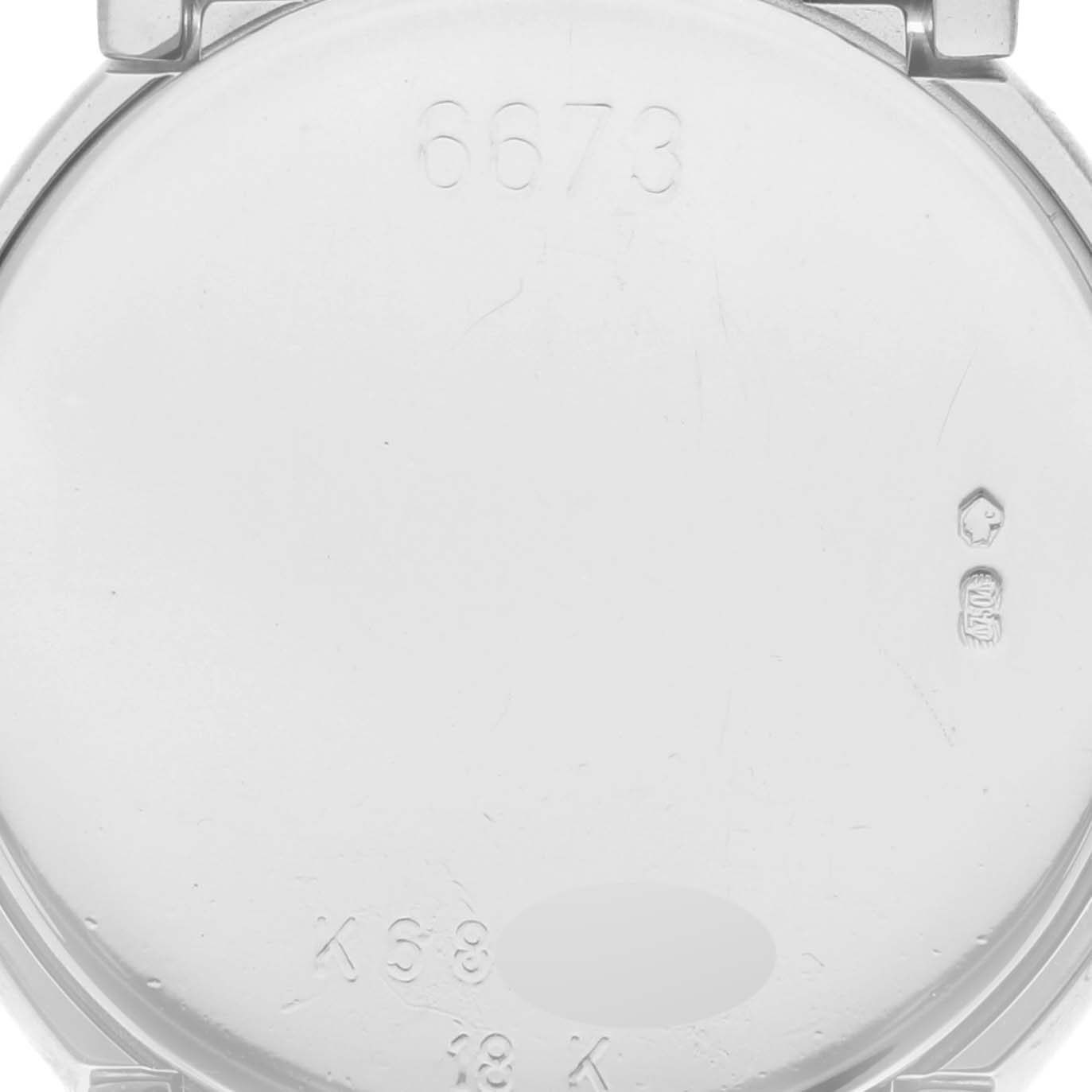 The image shows the inner case back of a Rolex Cellini 6673 Women's White Gold Mother of Pearl Dial watch, displaying engravings and hallmarks.