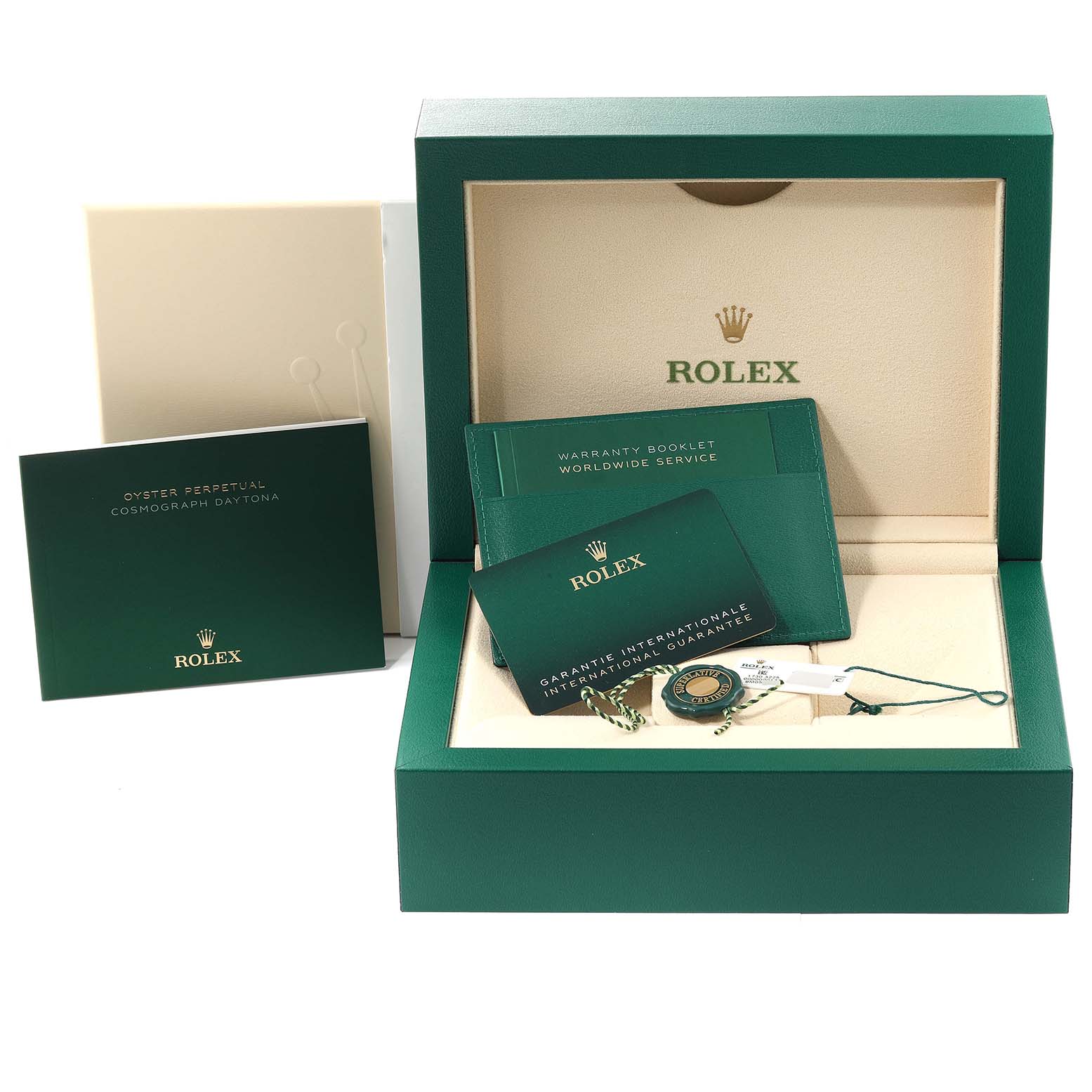 The image shows a Rolex Daytona 116519 Men's White Gold Black Dial 116519 Men's White Gold Black Dial packaging set with booklets, a warranty card, and a green presentation box.