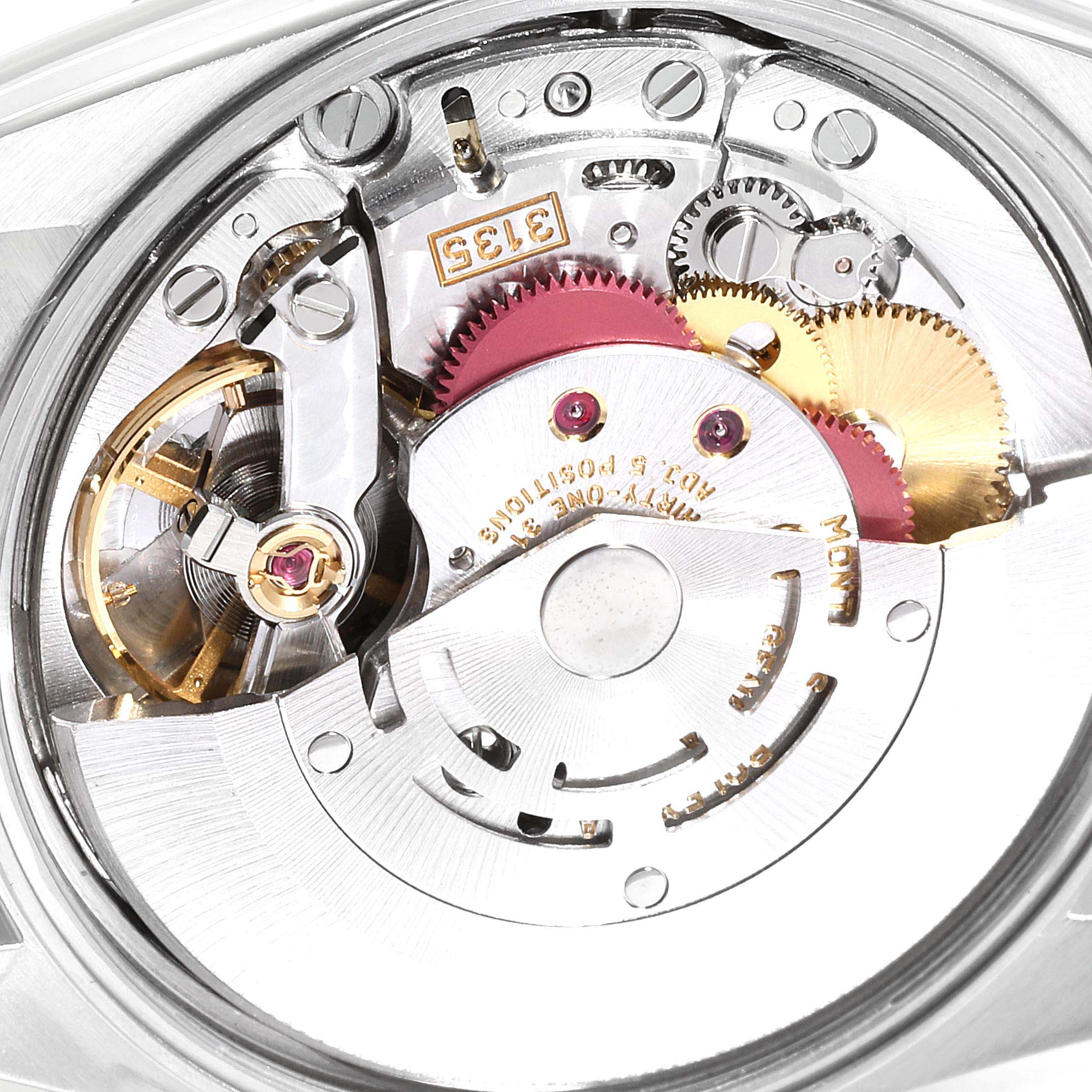 The image shows a close-up of the movement mechanism in a Rolex Date 15210 Men's Stainless Steel Black Dial 15210 Men's Stainless Steel Black Dial model watch.