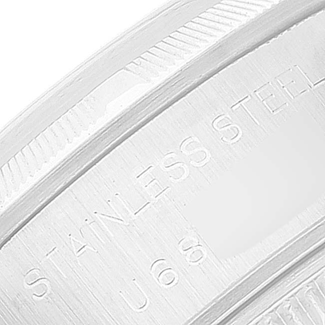 This is a detailed close-up of the engravings on the stainless steel case of a Rolex Date 69190 Women
s Stainless Steel Black Dial 69190 Women
s Stainless Steel Black Dial watch.