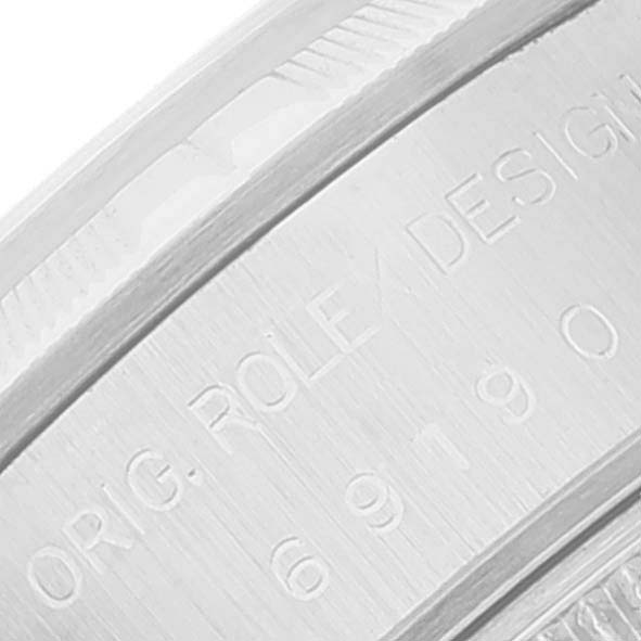 This close-up image shows the engraved inner side of the bezel of a Rolex Date 69190 Women
s Stainless Steel Black Dial 69190 Women
s Stainless Steel Black Dial model watch.