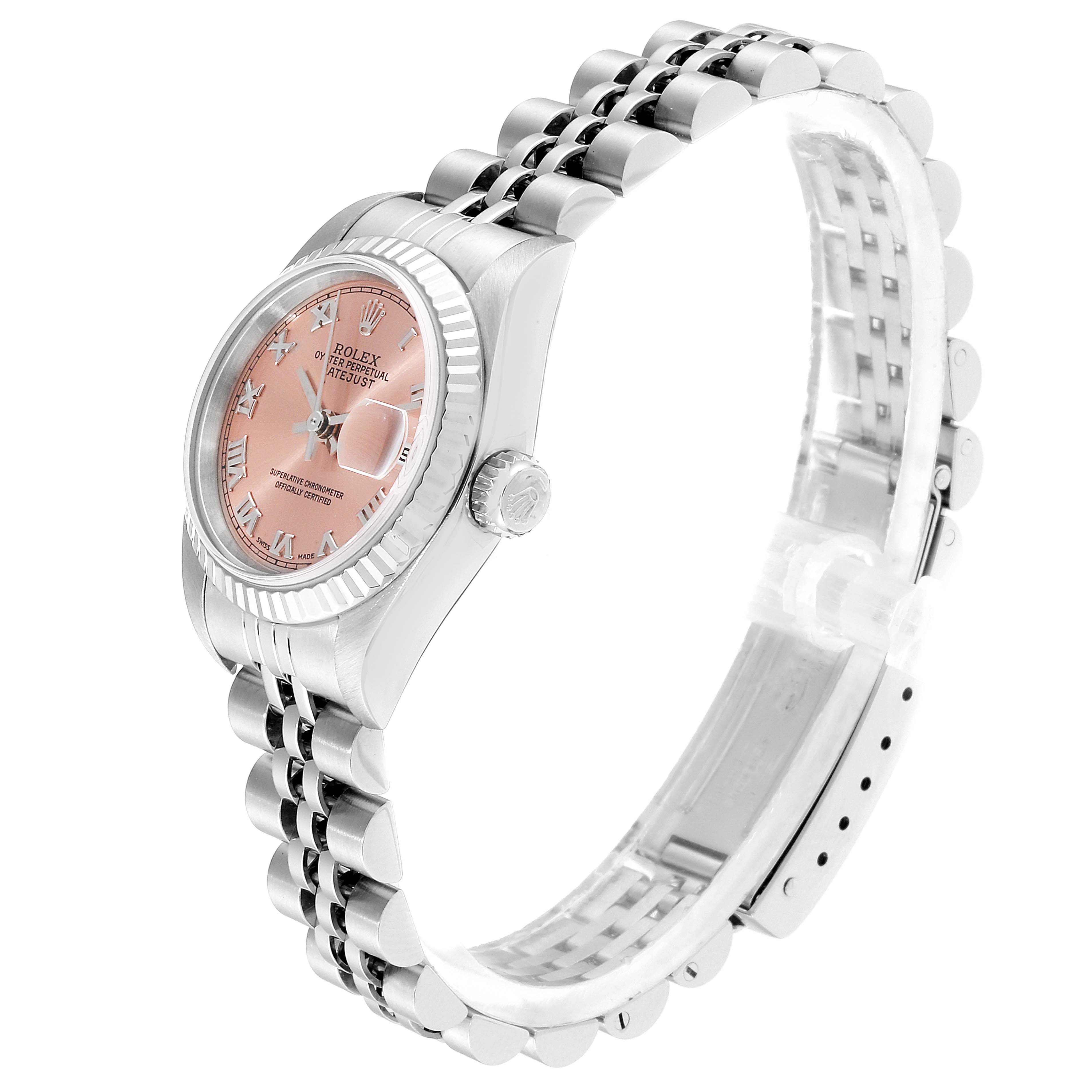 The image shows a Rolex Datejust 79174 Women's Stainless Steel Pink Dial 79174 Women's Stainless Steel Pink Dial watch at an angle, highlighting the pink dial, fluted bezel, and jubilee bracelet.