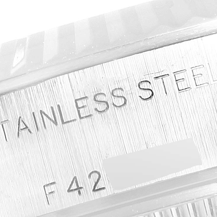 This image shows a close-up of the stainless steel case side with engravings on a Rolex Datejust 79174 Women's Stainless Steel Pink Dial 79174 Women's Stainless Steel Pink Dial watch.