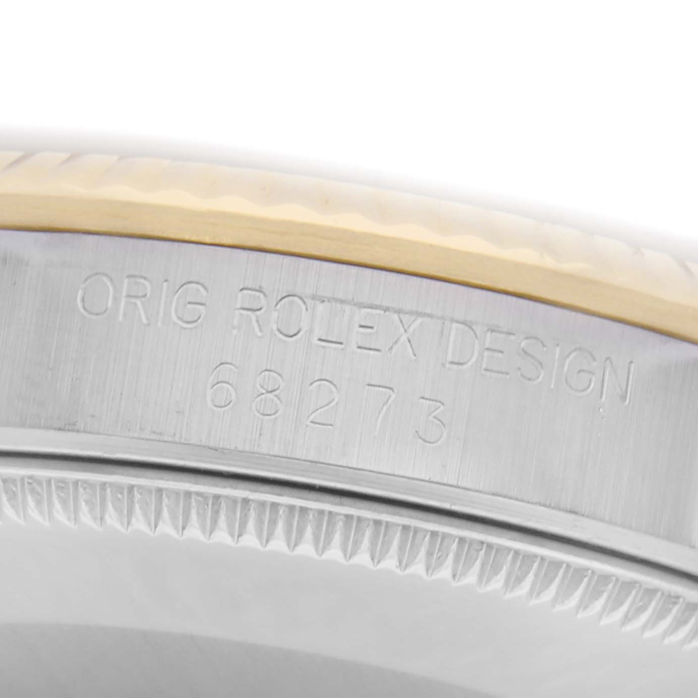 The image shows the side view of a Rolex Datejust model 68273, focusing on the engraved design number on the case.