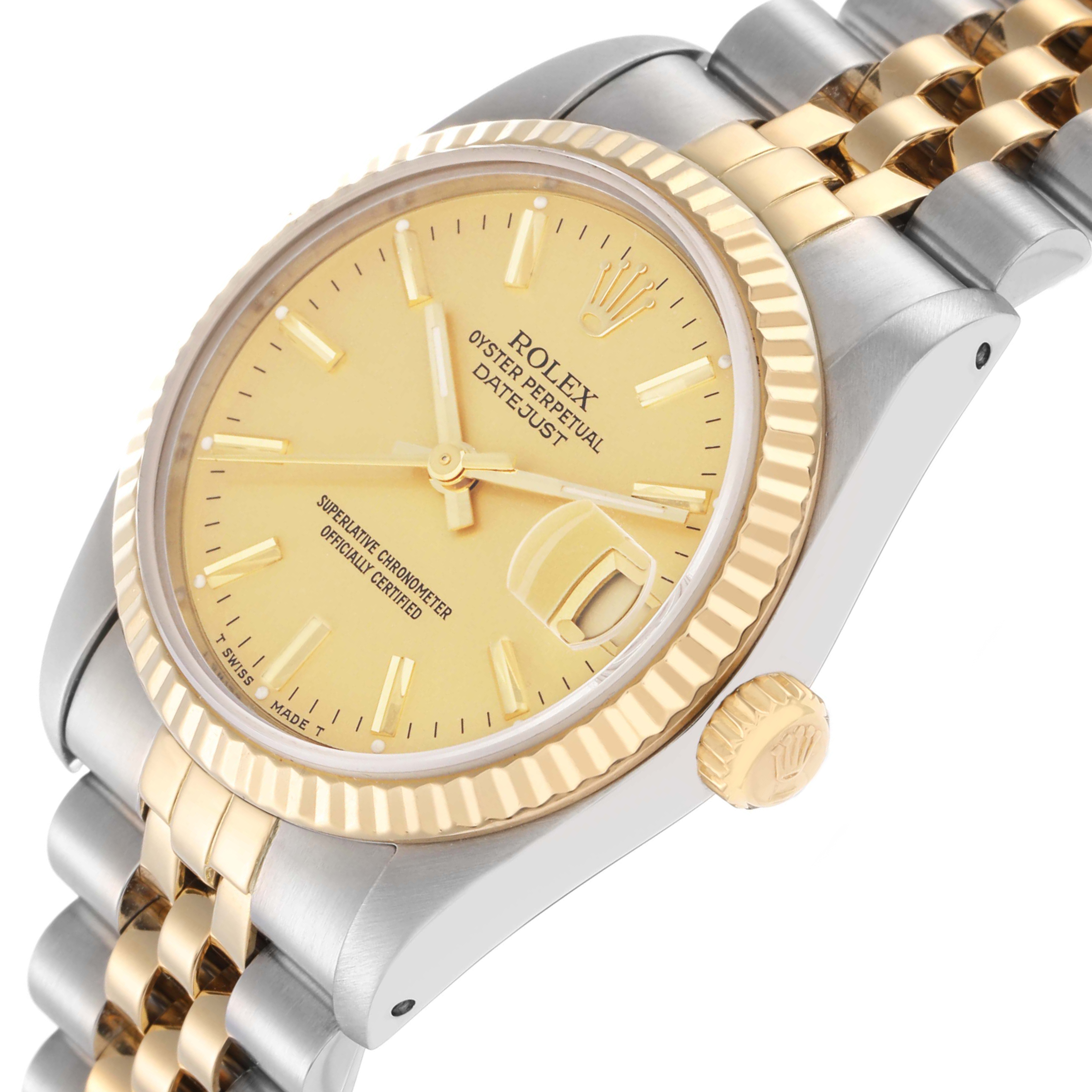 The Rolex Datejust model 68273 is shown at an angle highlighting the gold bezel, crown, and two-tone bracelet.