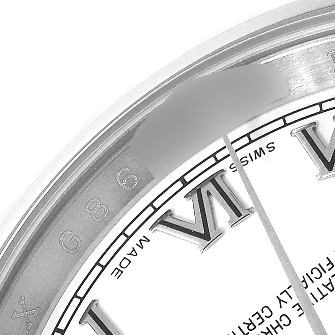 This close-up image shows the bezel and part of the dial with Roman numerals on a Rolex Datejust 116200 Men's Stainless Steel White Dial 116200 Men's Stainless Steel White Dial watch.