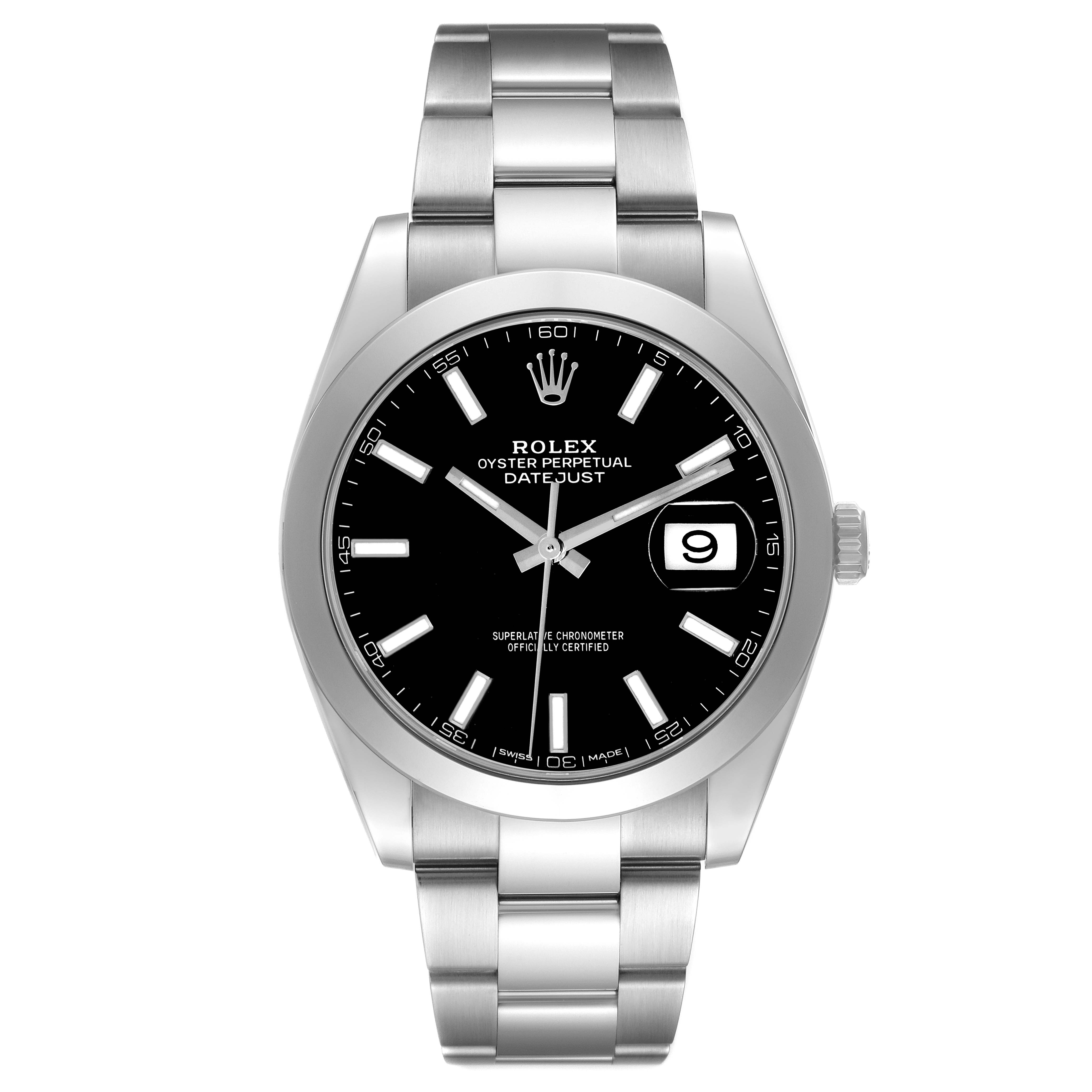 The image shows a Rolex Datejust model 126300 men's watch from a front angle, highlighting the black dial, date display, and stainless steel bracelet.