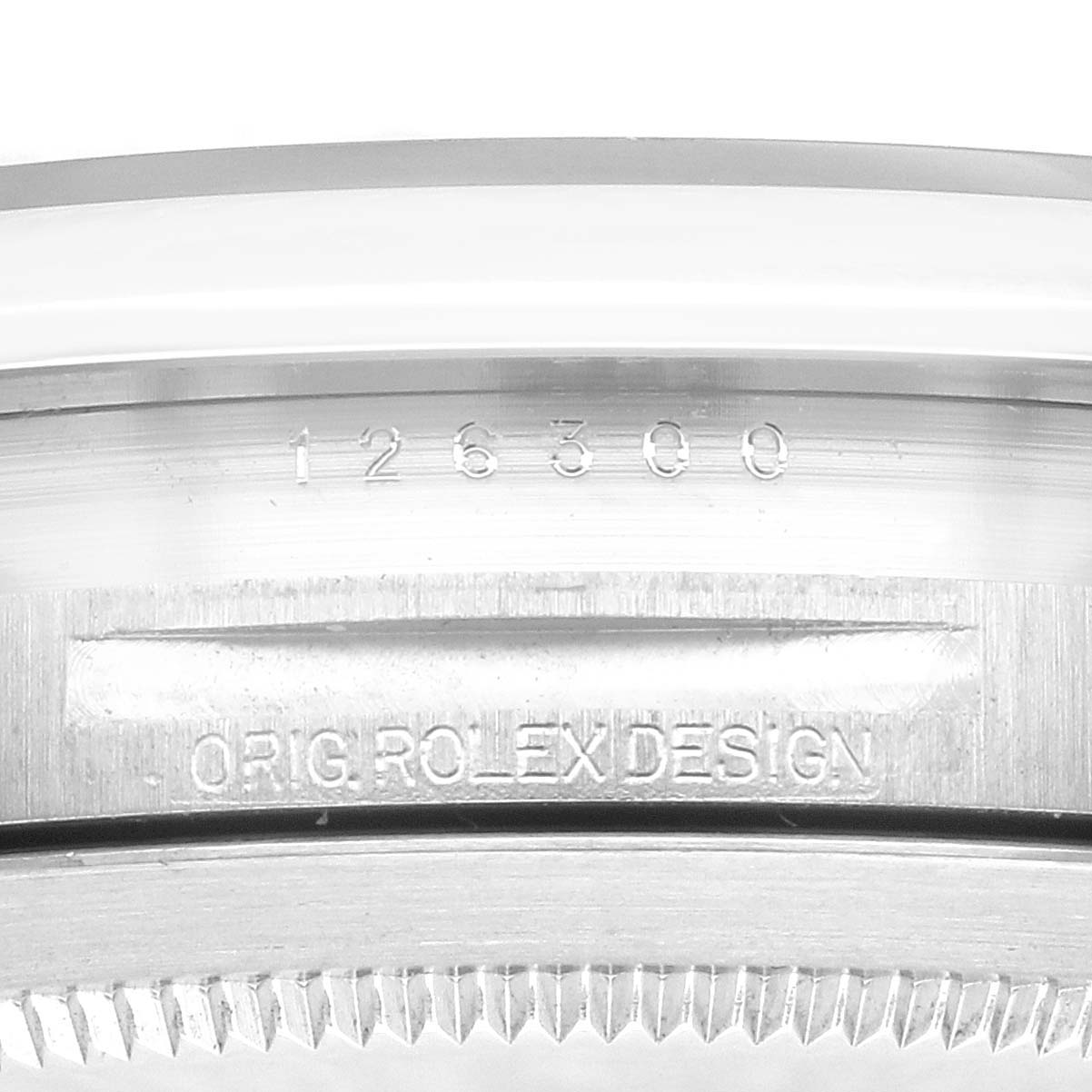 The image shows a close-up side angle of a Rolex Datejust (model 126300) case, highlighting the model number and "ORIG ROLEX DESIGN" engraving above the bezel.