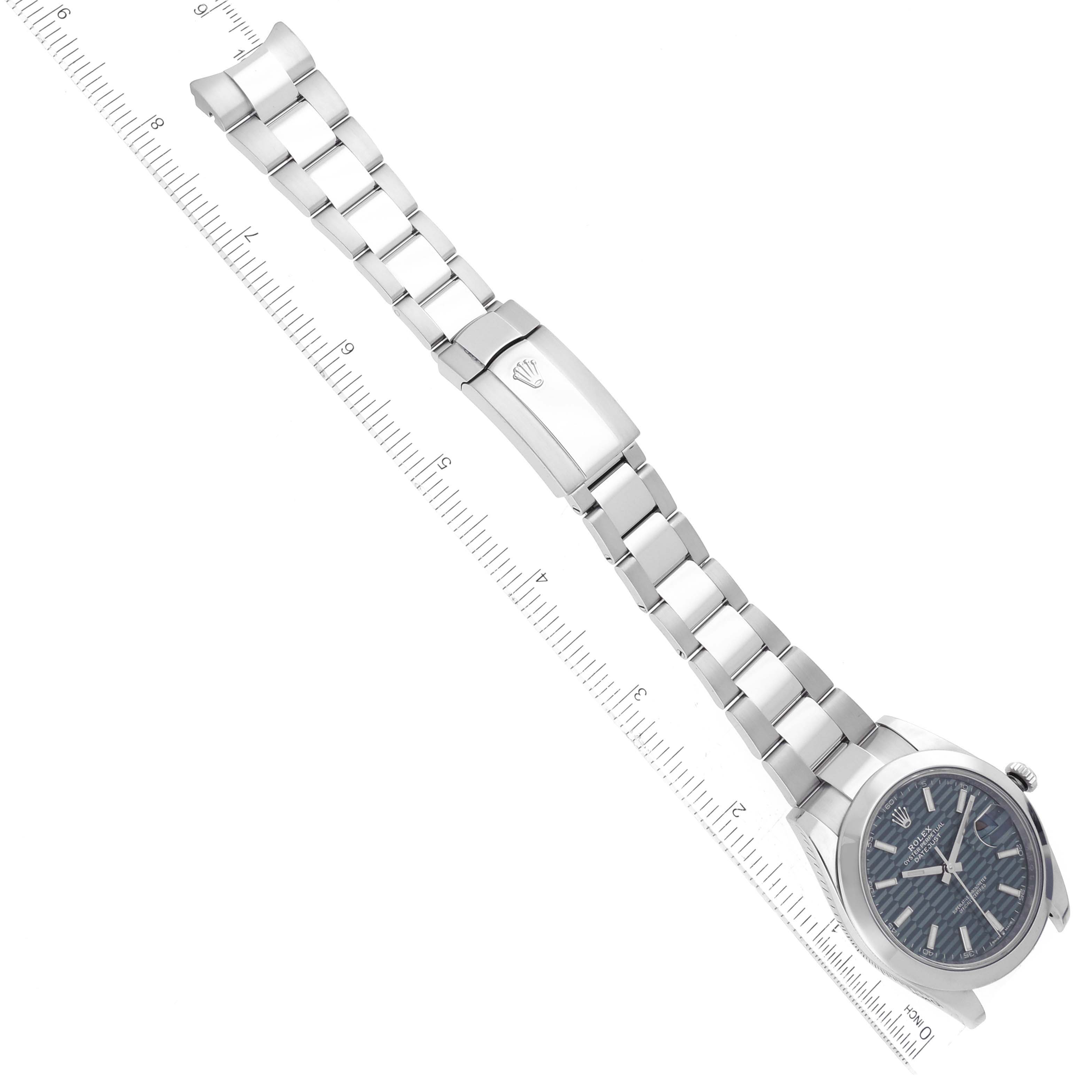 The image shows a top-down view of the Rolex Datejust 41 126300 Men's Stainless Steel Green Dial 126300 Men's Stainless Steel Green Dial watch, displaying its face, bracelet, and clasp alongside a ruler.