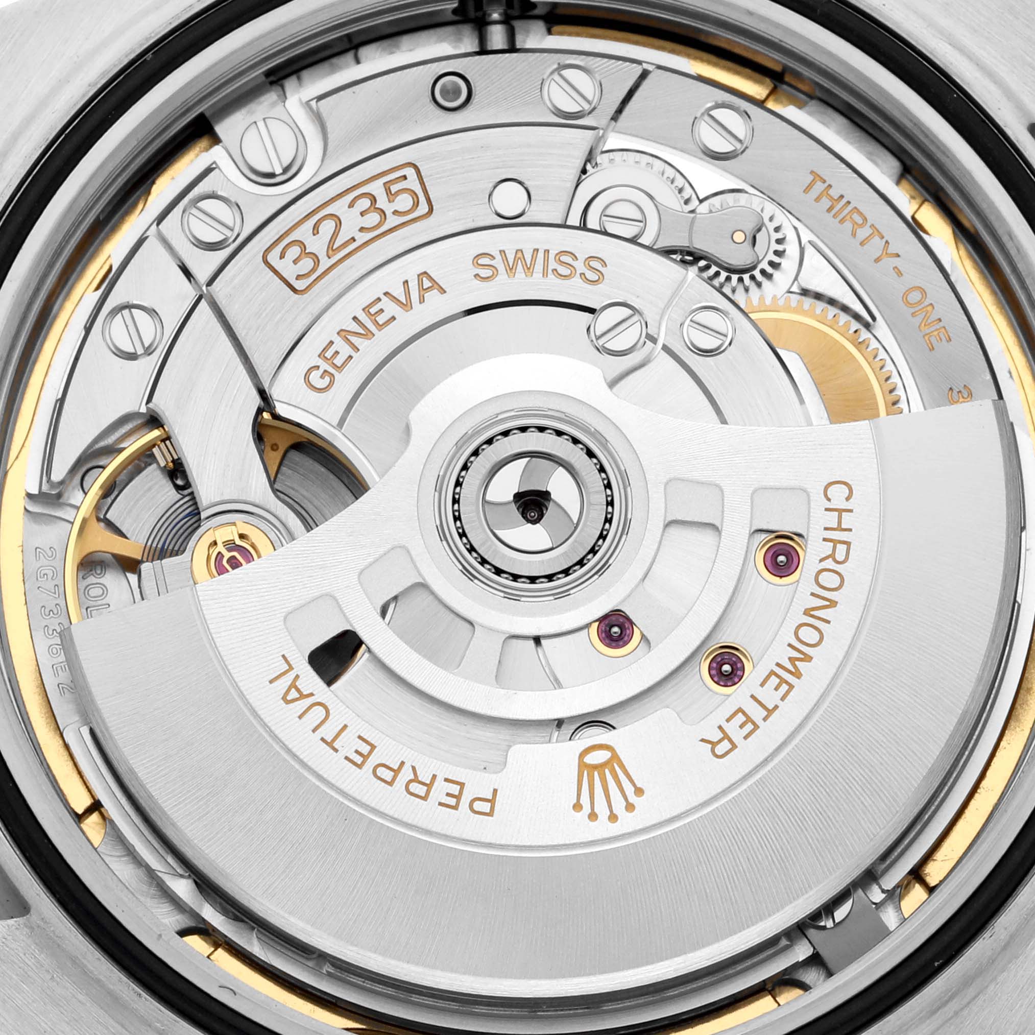 This close-up view shows the movement and inner mechanics of the Rolex Datejust 41 126300 Men's Stainless Steel Green Dial 126300 Men's Stainless Steel Green Dial, including the rotor and engraved details.