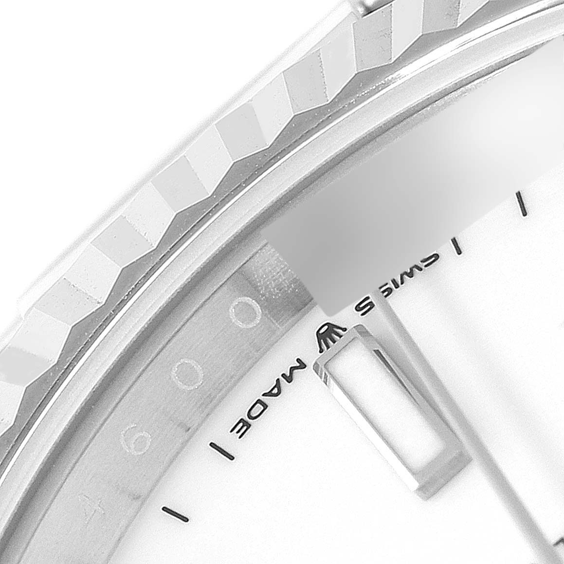 This image shows a close-up angle of the Rolex Datejust 41 126334 Men's Stainless Steel White Dial 126334 Men's Stainless Steel White Dial bezel, part of the dial, and the "Swiss Made" inscription.
