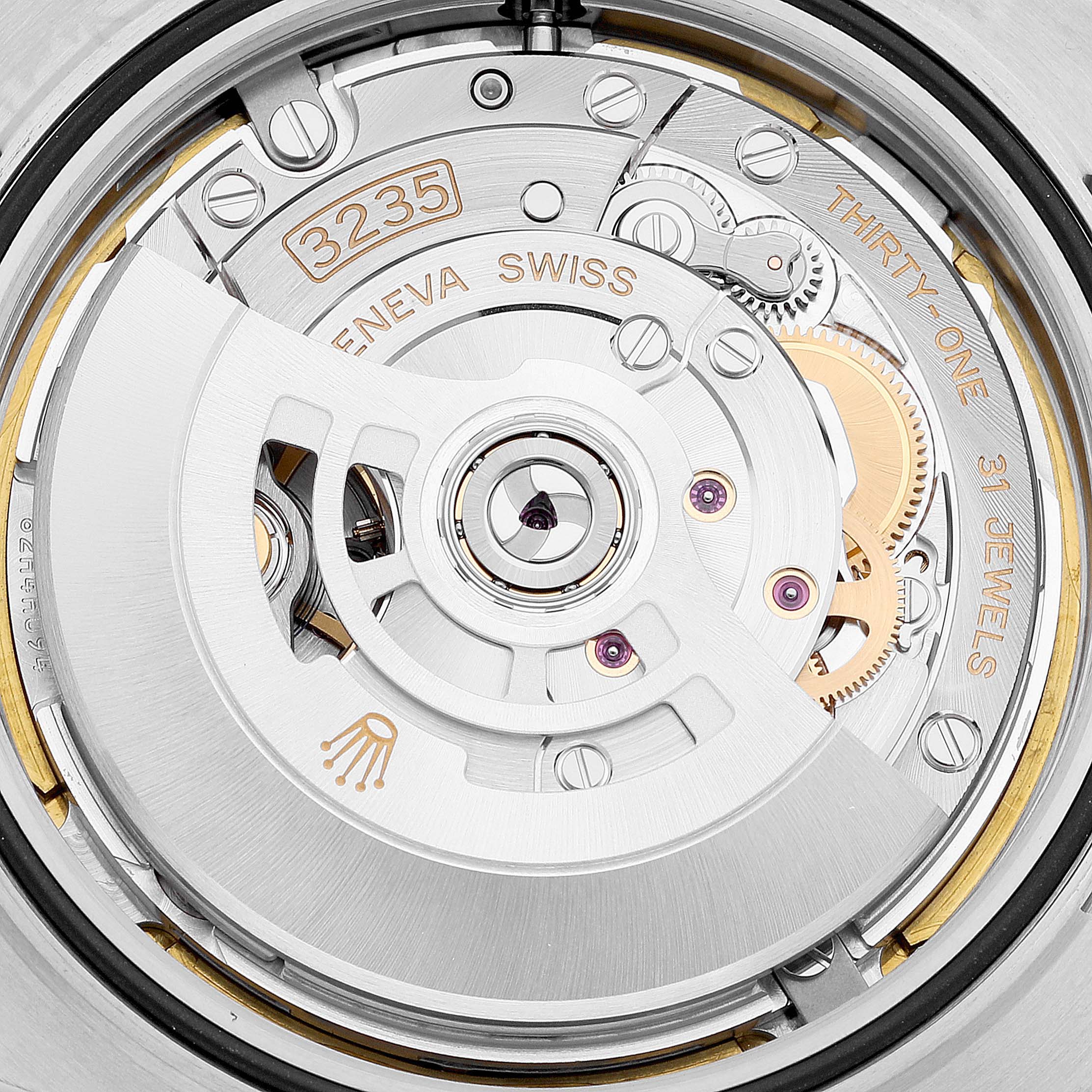 The image shows a close-up of the Rolex Datejust 41 126334 Men's Stainless Steel White Dial 126334 Men's Stainless Steel White Dial's movement, specifically the Caliber 3235 mechanism.