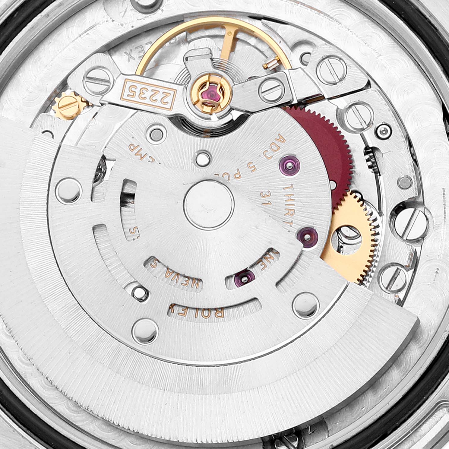 This is a close-up view of the internal mechanism of a Mid-Size Rolex watch, showcasing gears and the rotor.