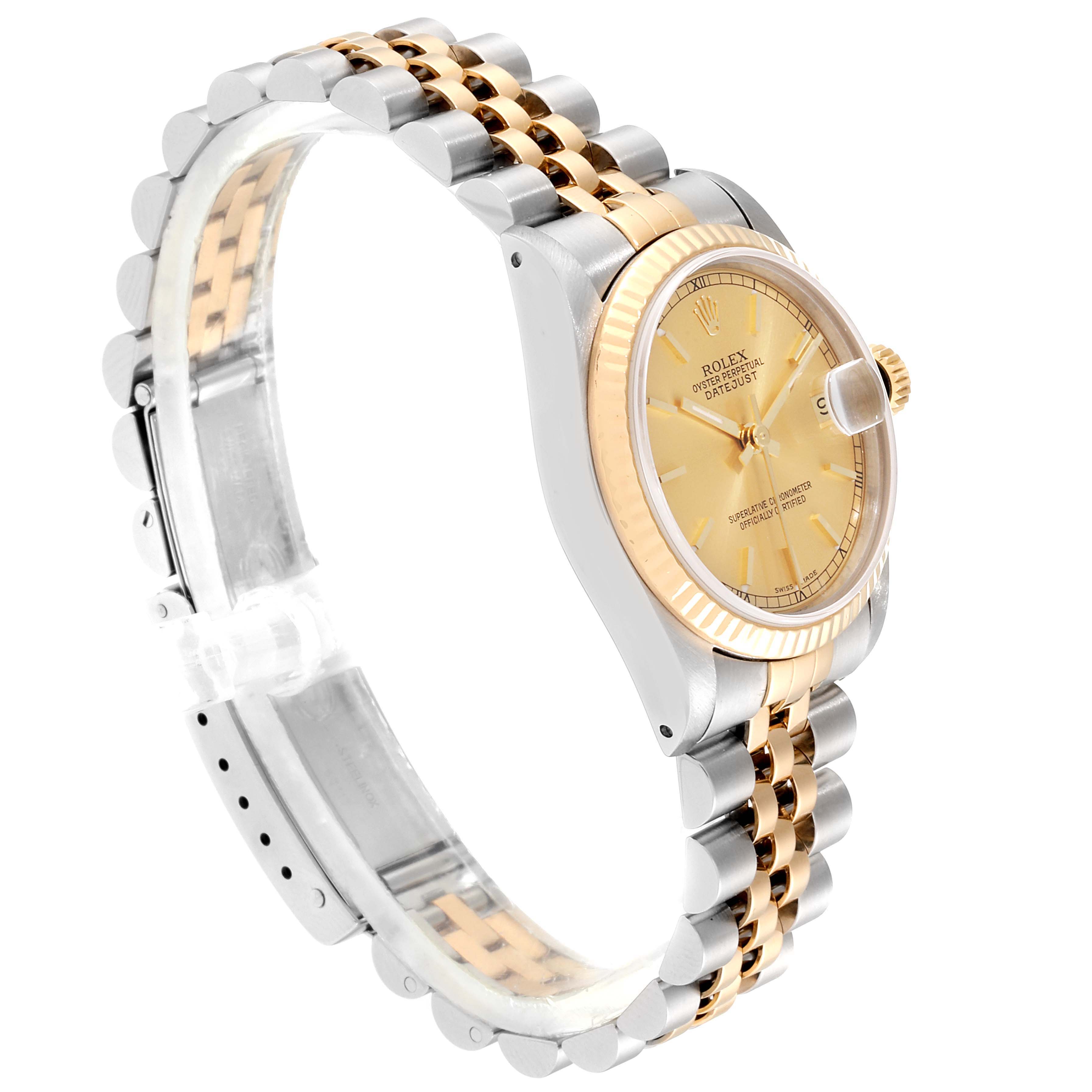 This image shows a side angle of a Rolex Datejust 68273  Women
s Steel and Gold (two tone) Champagne Dial 68273  Women
s Steel and Gold (two tone) Champagne Dial watch, highlighting the gold and silver bracelet, gold bezel, and gold dial.