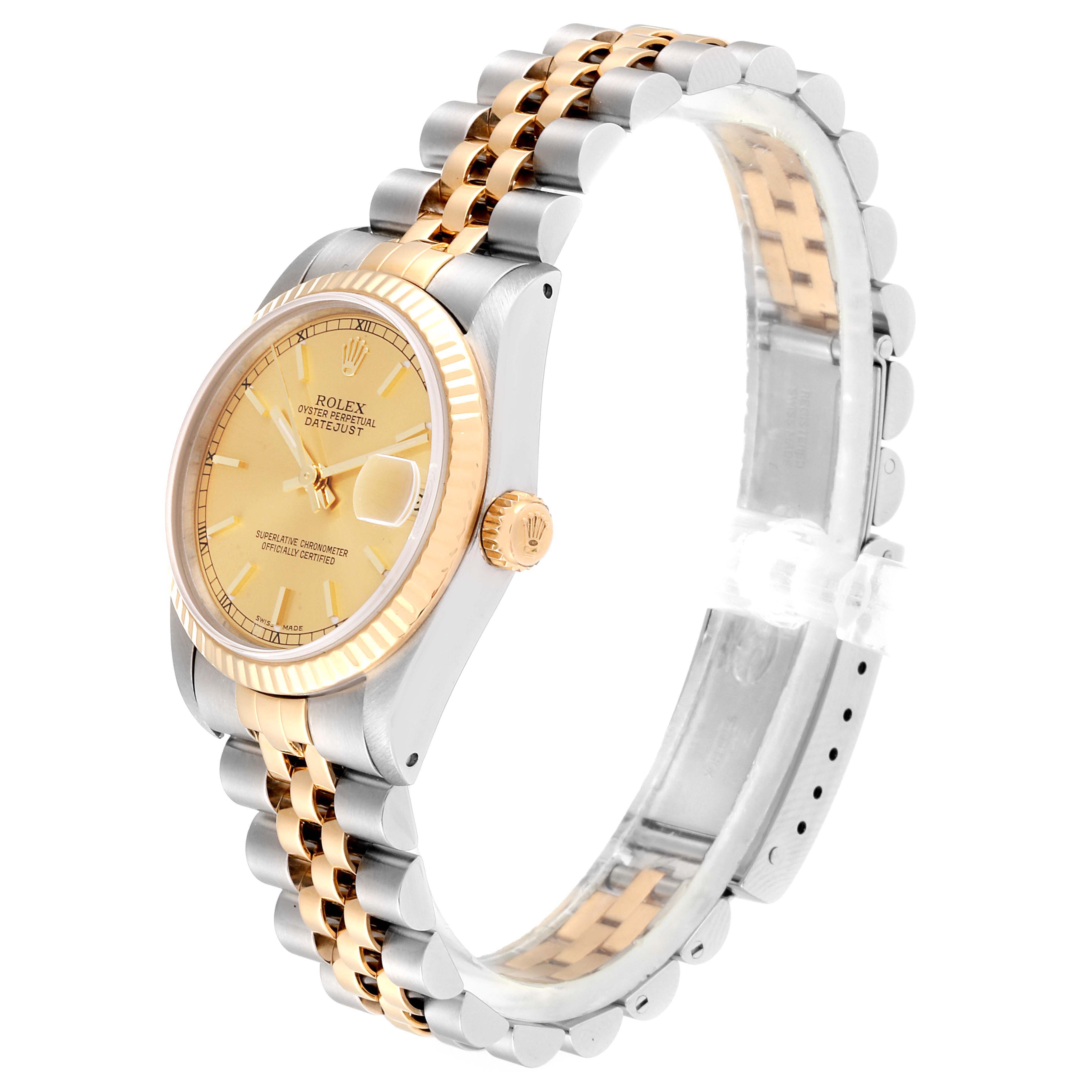 The Rolex Datejust 68273  Women
s Steel and Gold (two tone) Champagne Dial 68273  Women
s Steel and Gold (two tone) Champagne Dial watch is shown from an angled side view, highlighting its gold and silver bracelet and champagne dial.