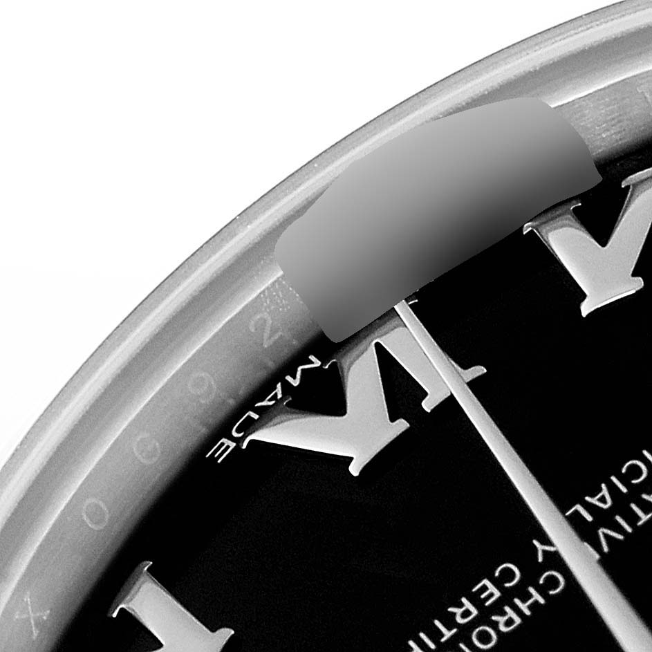 This close-up image shows the bezel, part of the dial, and a portion of the Roman numeral hour markers of a Rolex Datejust 178240 Women's Stainless Steel Black Dial 178240 Women's Stainless Steel Black Dial watch.