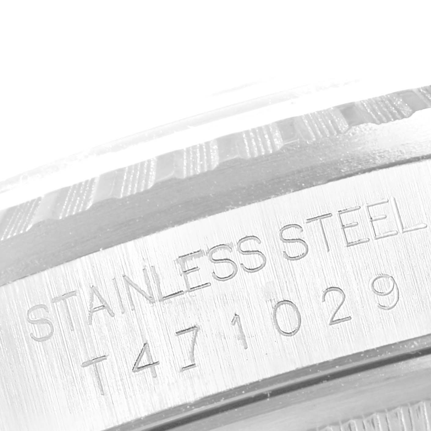 This close-up image shows the "Stainless Steel" engraving on the edge of the bezel of a Rolex Datejust 16220 Men's Stainless Steel Silver Dial 16220 Men's Stainless Steel Silver Dial watch.