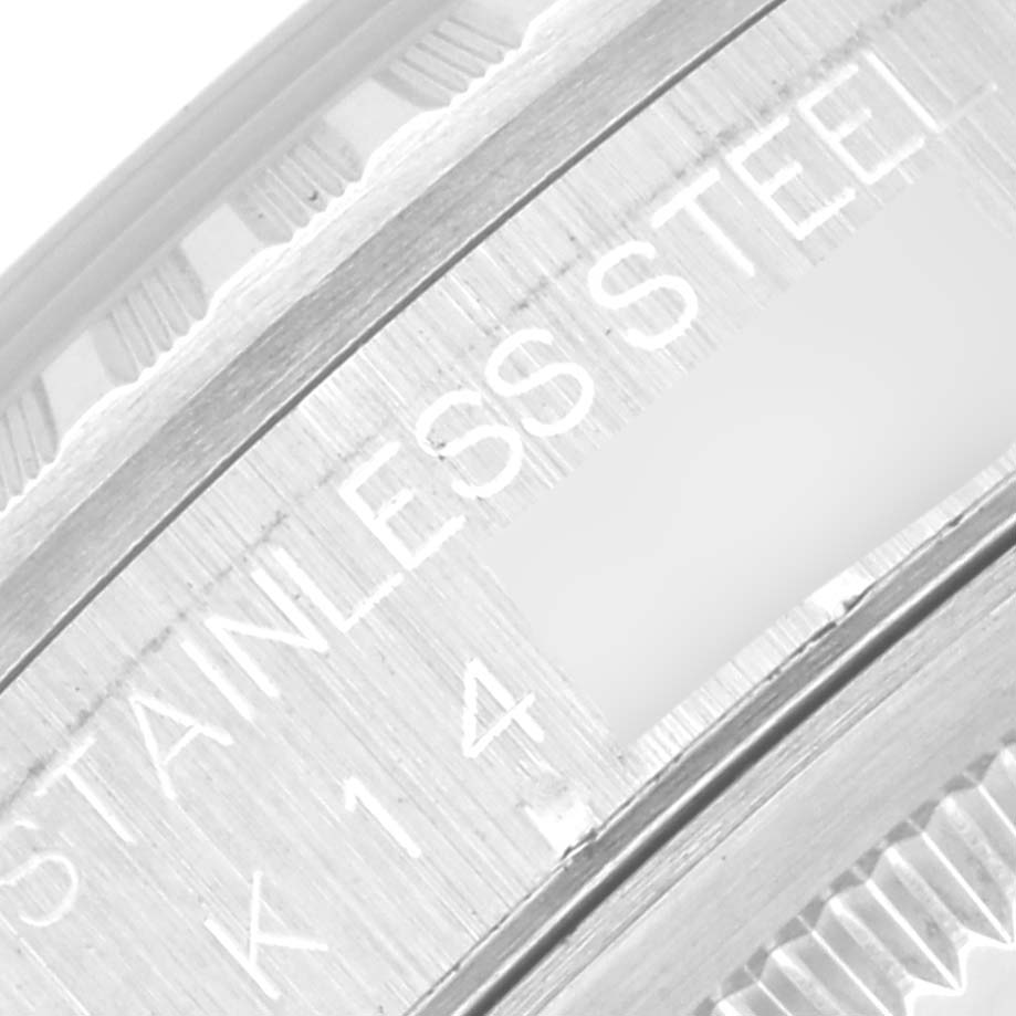 This close-up image of the Rolex Datejust 16220 Men
s Stainless Steel Silver Dial 16220 Men
s Stainless Steel Silver Dial showcases the side engraving on its stainless steel case.