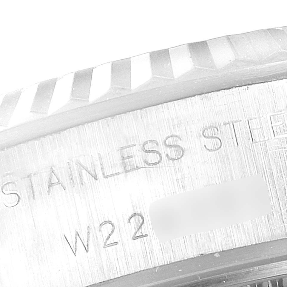 This close-up image shows the inscription on the stainless steel case of a Rolex Datejust 69174 Women's Stainless Steel Blue Dial 69174 Women's Stainless Steel Blue Dial watch.