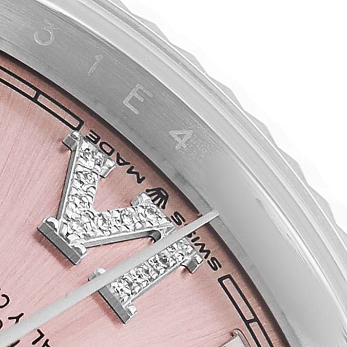 The image shows a close-up of a Rolex Datejust 126234 Men's Stainless Steel Pink Dial watch, highlighting its bezel, part of the pink dial, and crystal-set hour markers.